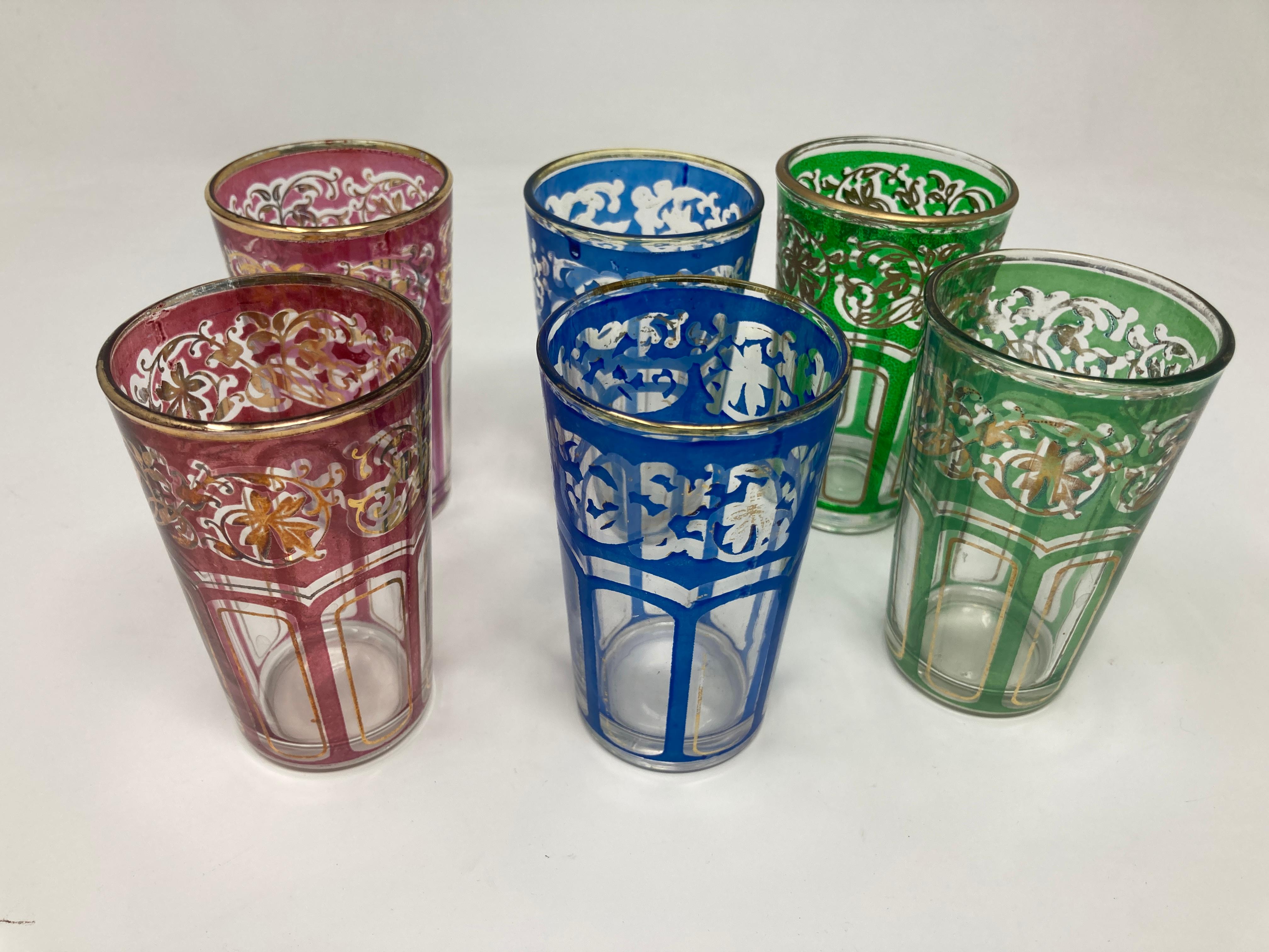 Set of six vintage Moroccan colored glasses with gold raised Moorish design.
Decorated with a classical gold and pattern Moorish frieze.
Use these elegant vintage glasses for Moroccan tea, or any hot or cold drink.
Perfect for the holidays and