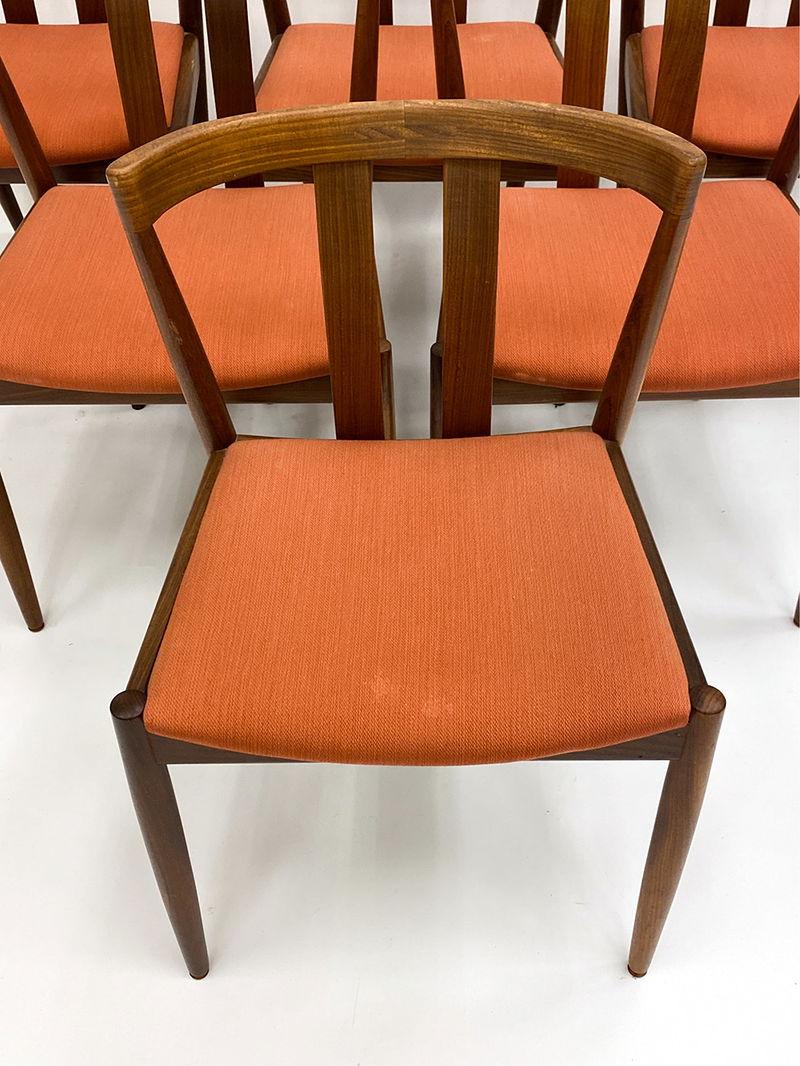 This Danish-crafted set is made from solid teak, combining lasting durability with clean, refined design. The minimalist frames feature rounded edges, tapered legs, and open backs that emphasize the natural beauty of the wood. Recently reupholstered