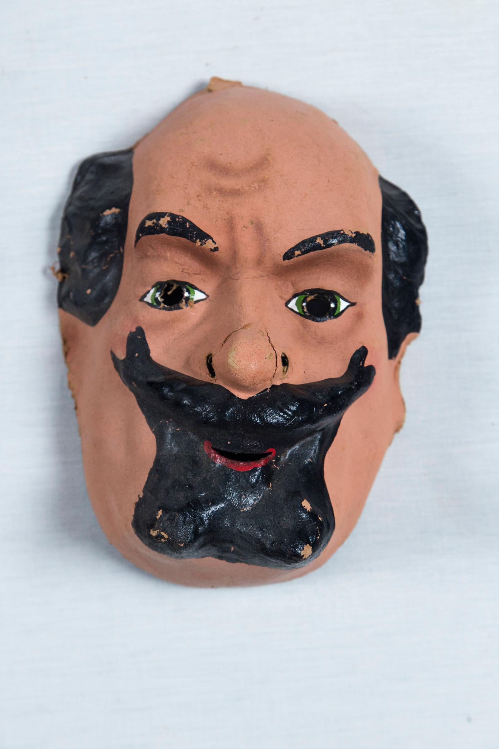 Very animated face masks from the 1940s. Three dimensional.