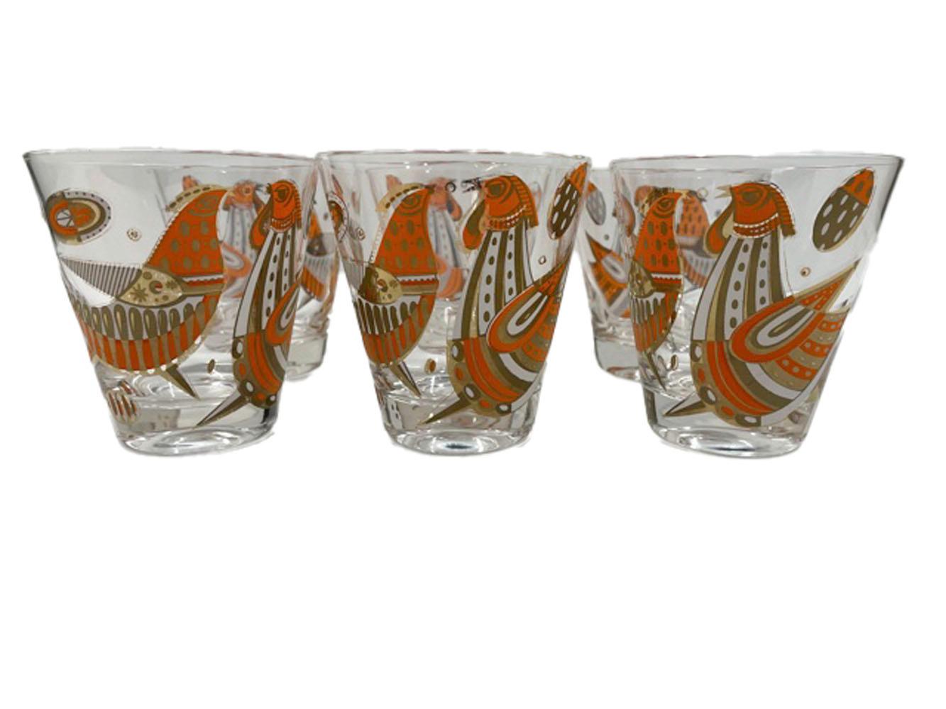 Set of six Mid-Century Modern double old fashioned cocktail glasses each decorated with a pair of courting fowl in orange and white enamel with 22k gold.