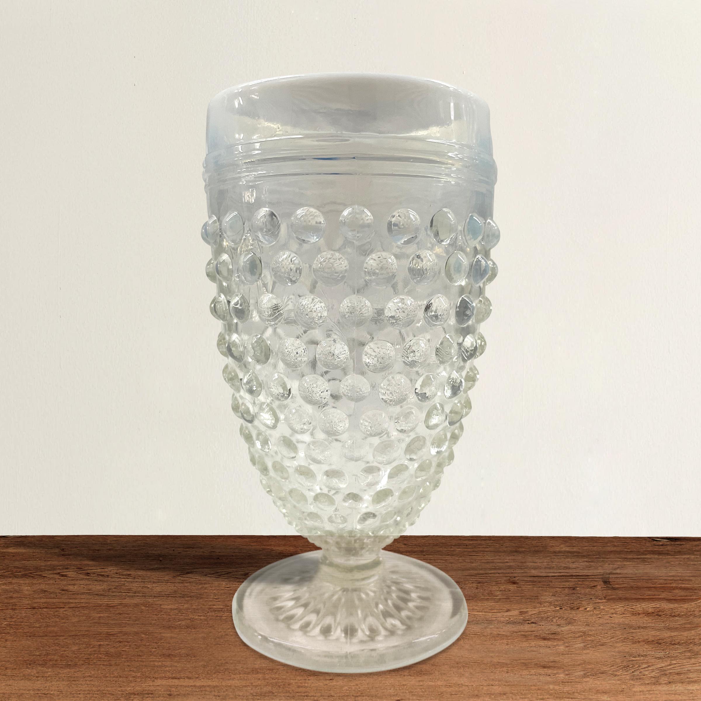 A playful set of six vintage American hobnail juice glasses with opaque white rims fading to a clear glass at the bottom. Perfect for your next garden or brunch party!