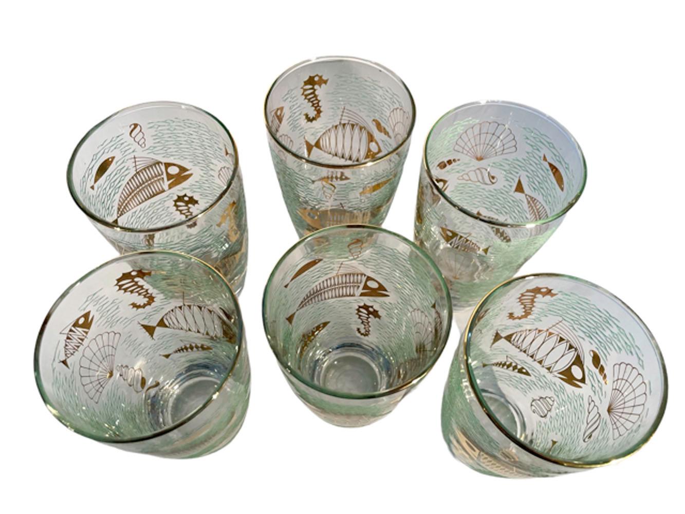 Set of six Libbey glassware 'Marine Life' tumblers or highball glasses with various fishes and marine animals in 22k gold on a ground or raised translucent green enamel waves.