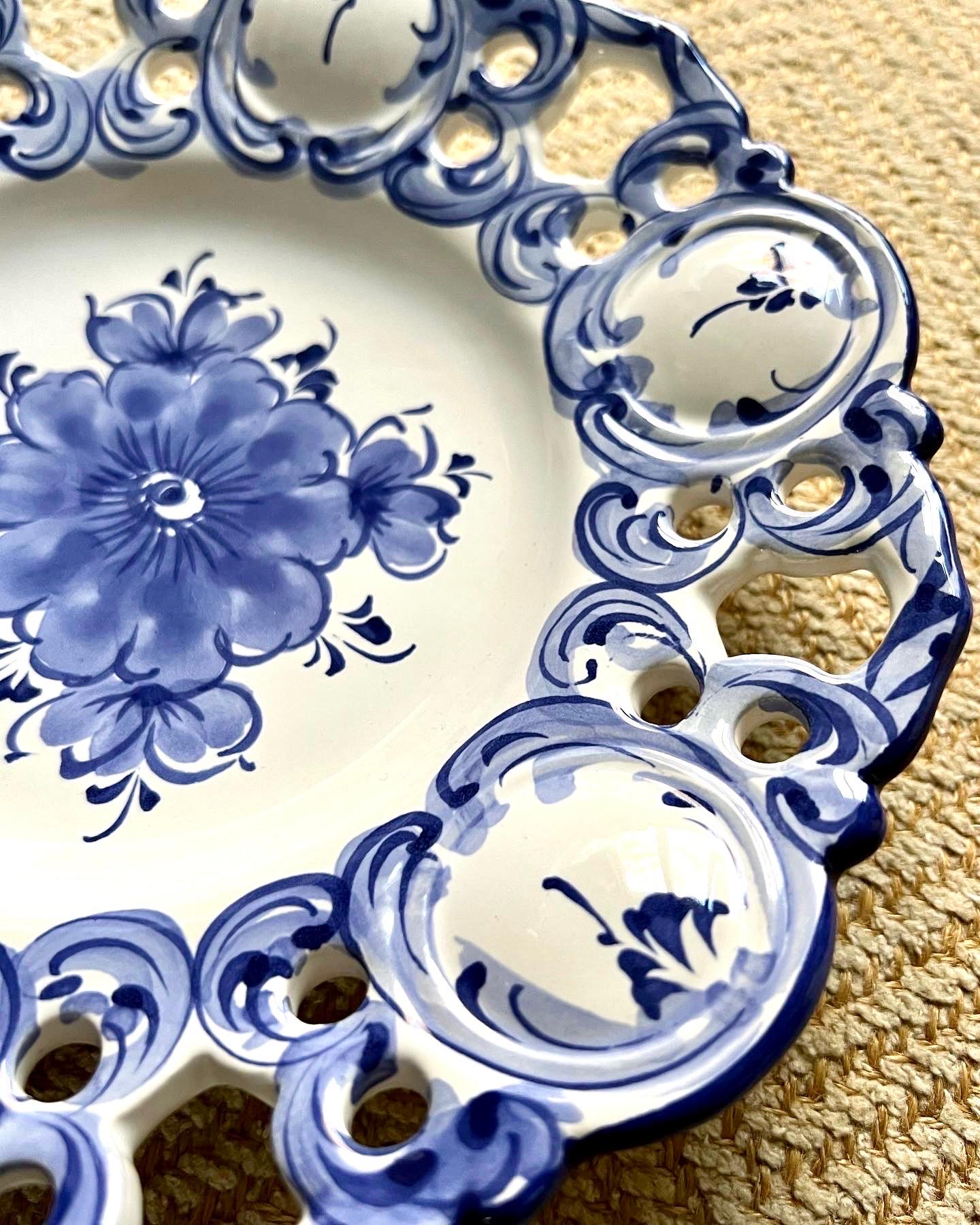 A rare set of 6 hand-painted blue and white pottery hanging wall plates. Only 2 plates have existing wire for hanging but all of them have holes for wire. Each plate is numbered and made in Portugal; they are not signed but look like Vestal