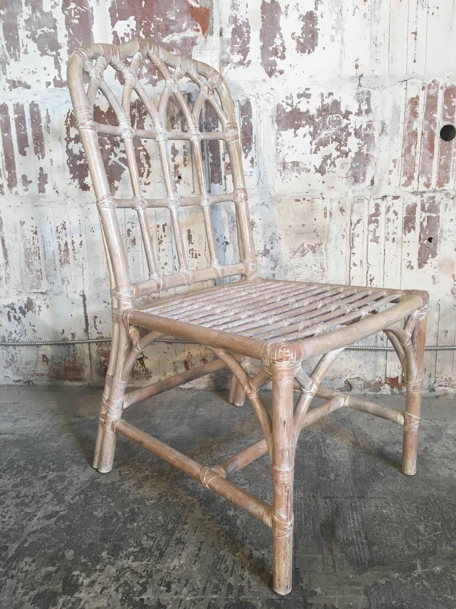 Set of 6 cathedral style Chinese Chippendale bamboo dining chairs by McGuire. Excellent structural condition and only minor abrasions consistent with age. Cushions have minor staining.
