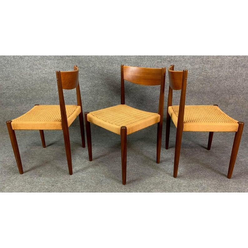 Here is a stunning set of six Scandinavian Modern dining chairs in teak and paper cord designed by Poul Volther and manufactured by Frem Rojle in Denmark in the 1960s.
This exquisite set of chairs features a solid teak frame and backrest cleaned up