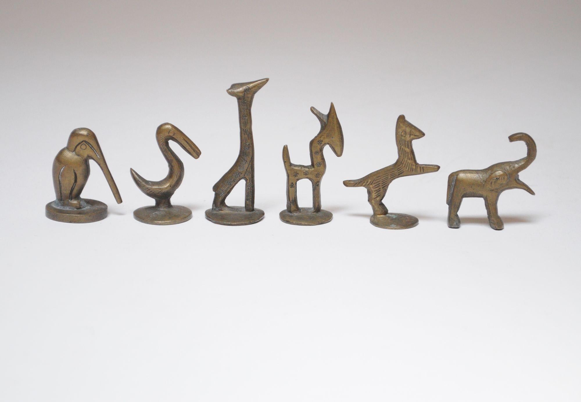 Charming set of six small animal-form tobacco pipe tampers/figurines (ca. 1950s, Austria).
Includes a long-billed pelican, stork, giraffe, deer, horse or zebra, and elephant (all but the elephant feature a round flat bottom for tamping tobacco