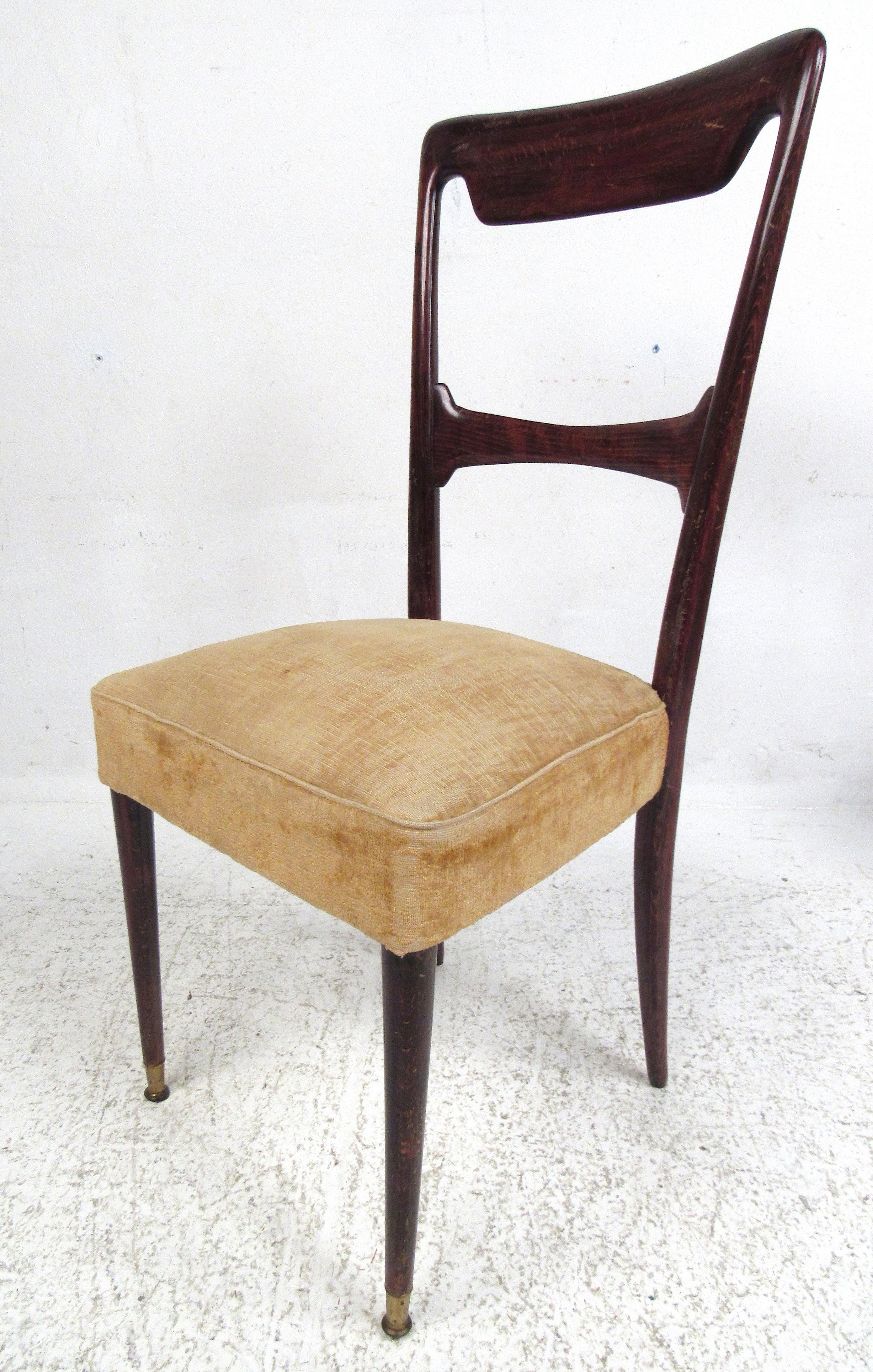 Exceptionally rare dining chairs from legendary Italian designer Guglielmo Ulrich. These beautifully sculpted mahogany chairs exemplify the sleek lines and subtle elegance of early Mediterranean mid-century modern design.  Crushed velvet seating and