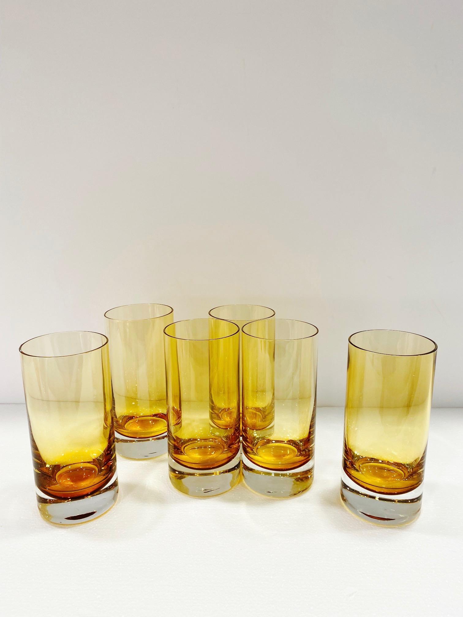 Set of six Mid-Century Modern hand blown Murano barware or dinnerware glasses. Sommerso cased glass design in yellow amber over clear glass. Exquisite design in heavy weight glass. Makes a chic addition to any barware or tableware set.