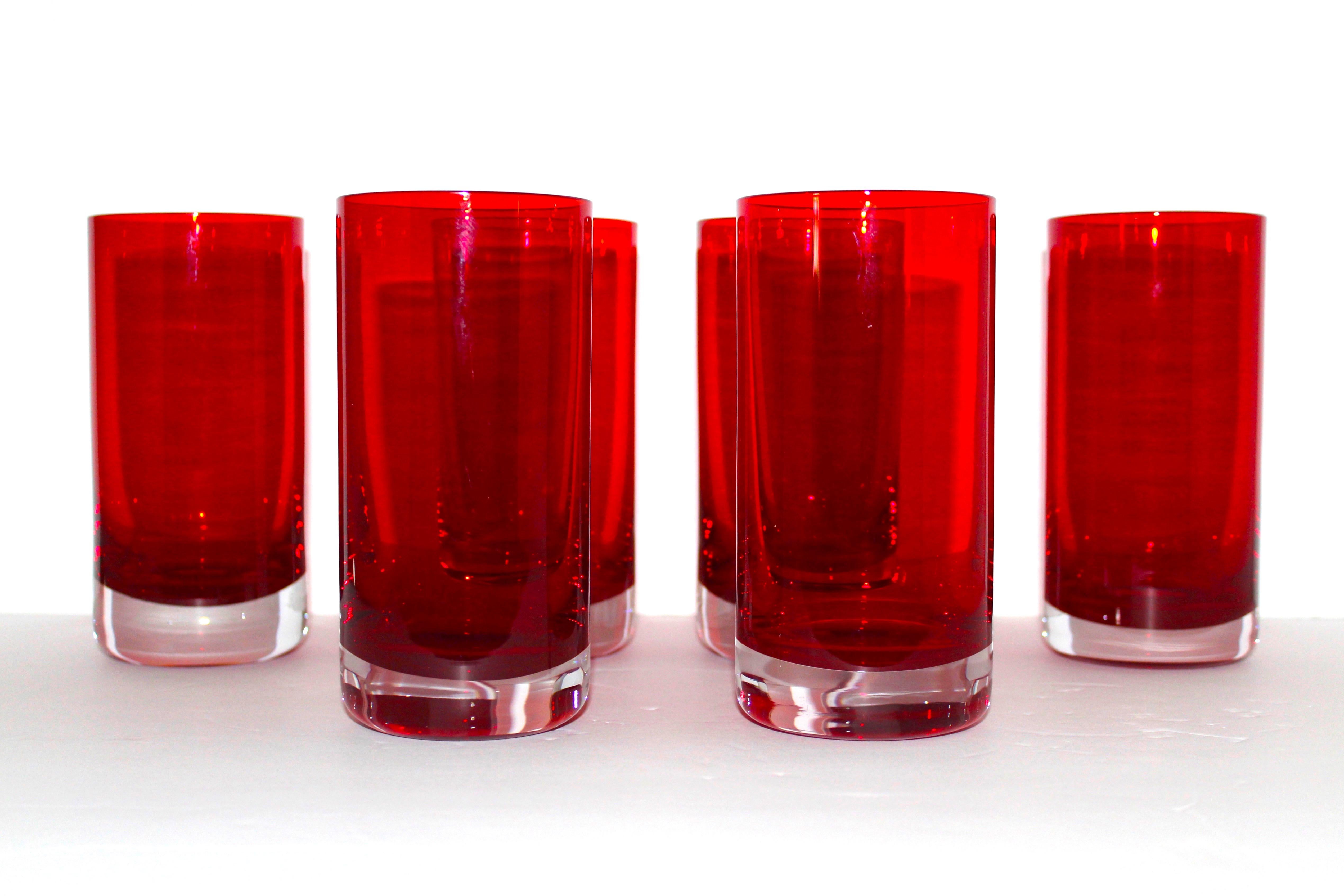 Set of six Mid-Century Modern hand blown Murano highball glasses. Sommerso cased glass design in garnet red over clear glass. Exquisite design in heavy weight glass. Makes a chic addition to any barware or tableware set.