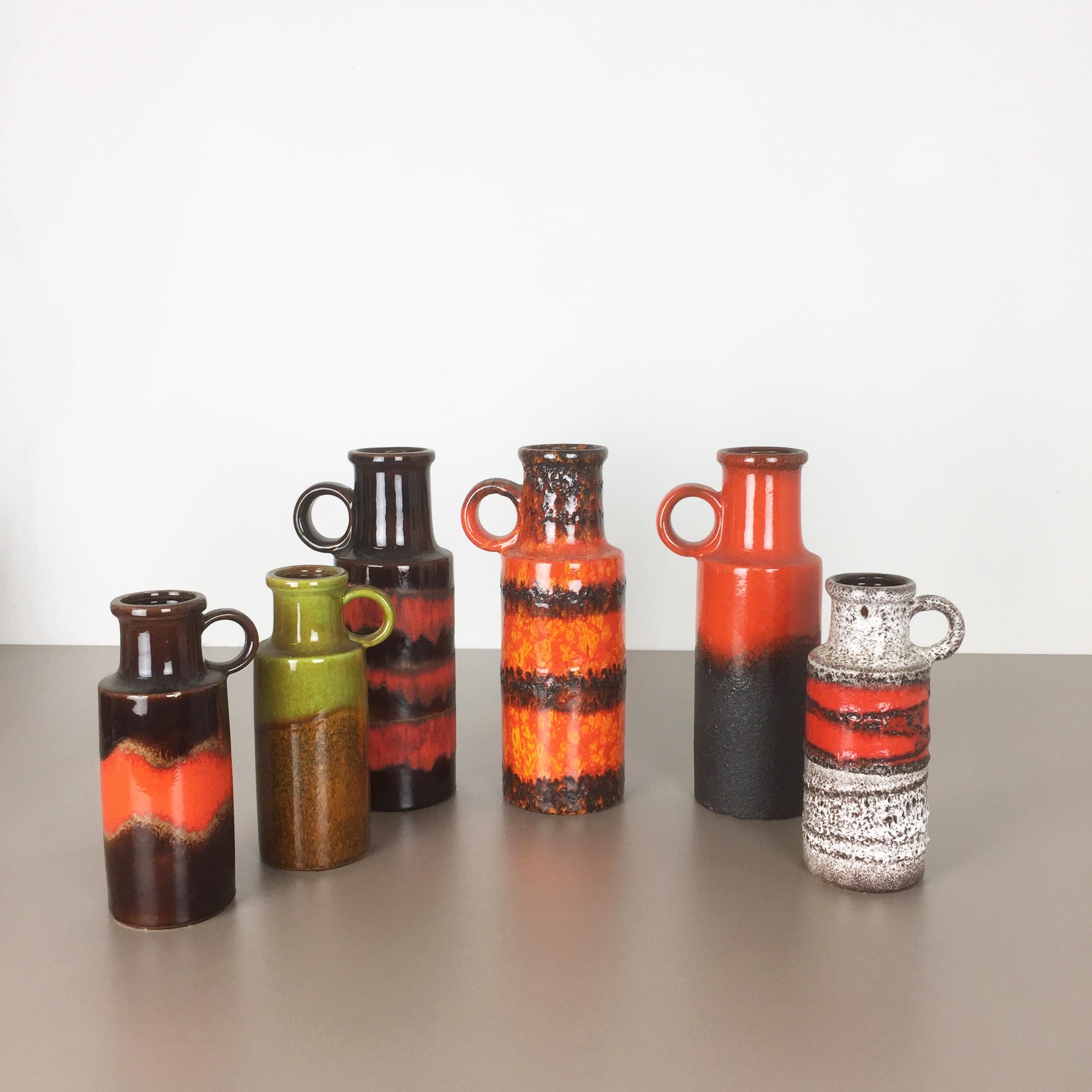 Article:

Set of four fat lava art vases

Producer:

Scheurich, Germany


Design:

Nr. 401-28
and 
Nr. 401-20



Decade:

1970s


Description:

This original vintage vase collection was produced in the 1970s in Germany. this