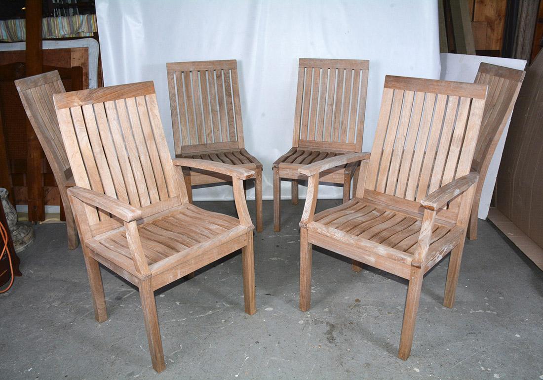 Handsome natural teak wood outdoor patio, garden or deck dining chairs, 2 arms and 4 side chairs. Chairs are in wonderful sturdy condition. They are a generous comfortable size made from sustainable teak. Comprised of a slatted back and seat and