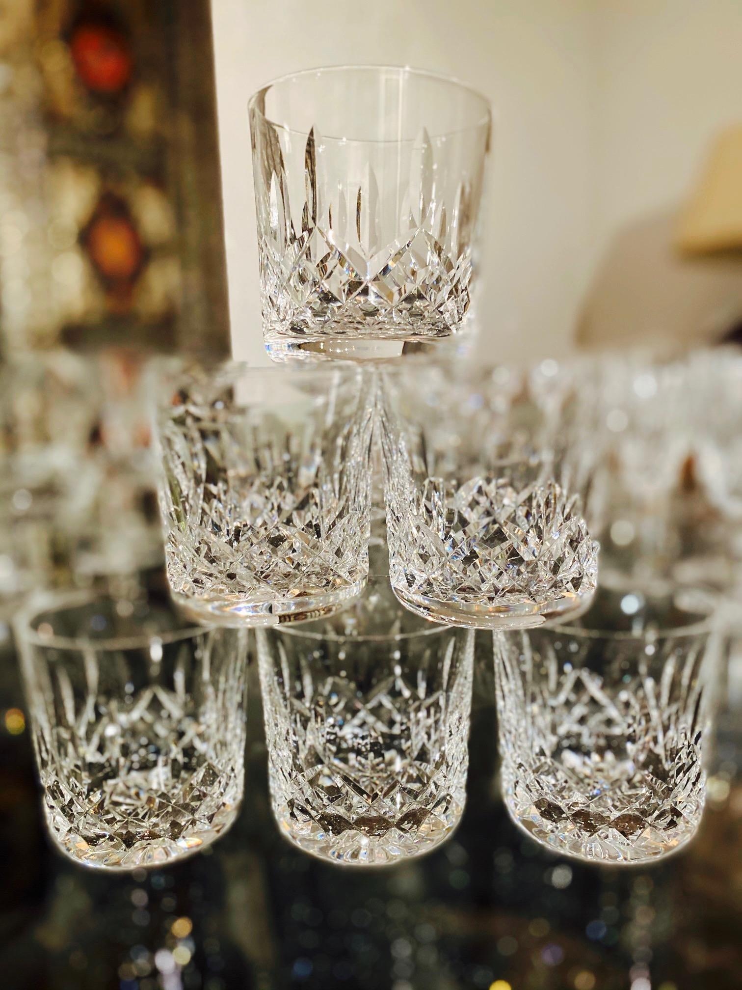 Set of six luxury crystal rock whiskey glasses from Waterford Crystal. The Lismore Collection is perhaps Waterford's most distinguished design featuring hand blown crystal with the pattern's signature diamond and wedge cuts. First introduced in the