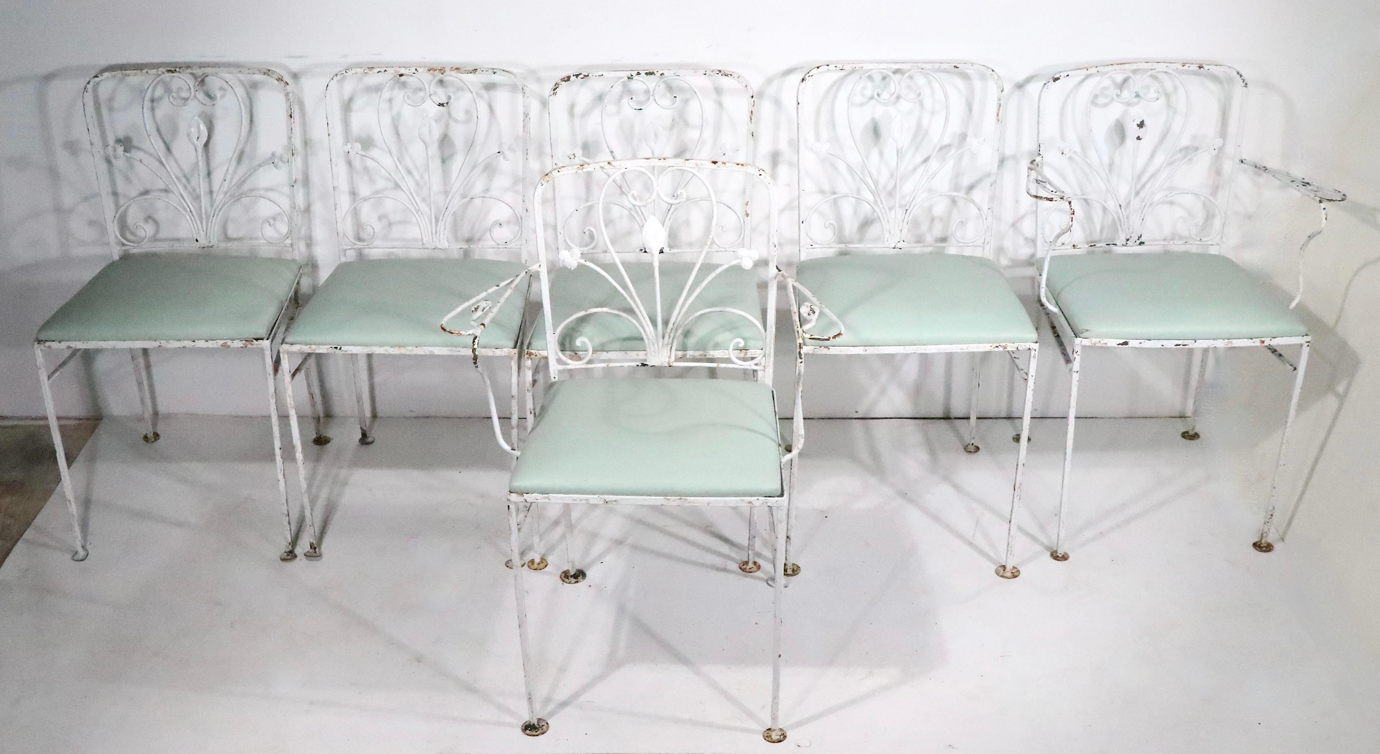 Nice matching set of six vintage wrought iron, and upholstered,  garden,  patio, poolside, dining chairs, attributed to Woodard, in the style of Salterini.  circa 1930- 1950's. The chairs are all structurally sound and sturdy, some of the metal
