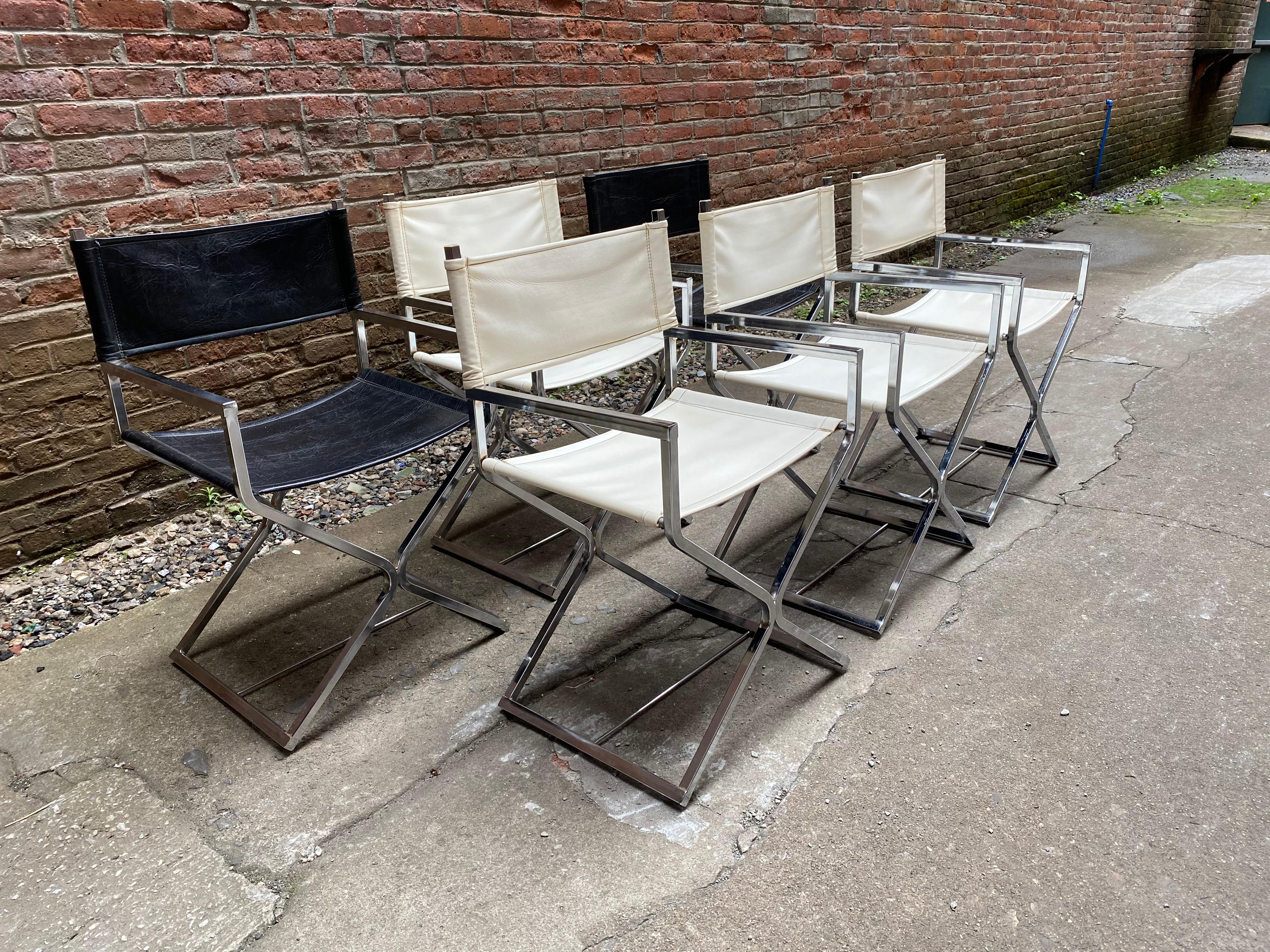 Set of six chrome and Naugahyde director chairs made by Virtue Brothers, Los Angeles, CA. Four white and two black. Chrome-plated frames with Naugahyde sling backs and seats. One still retains the original label, circa 1970.

Stylish and