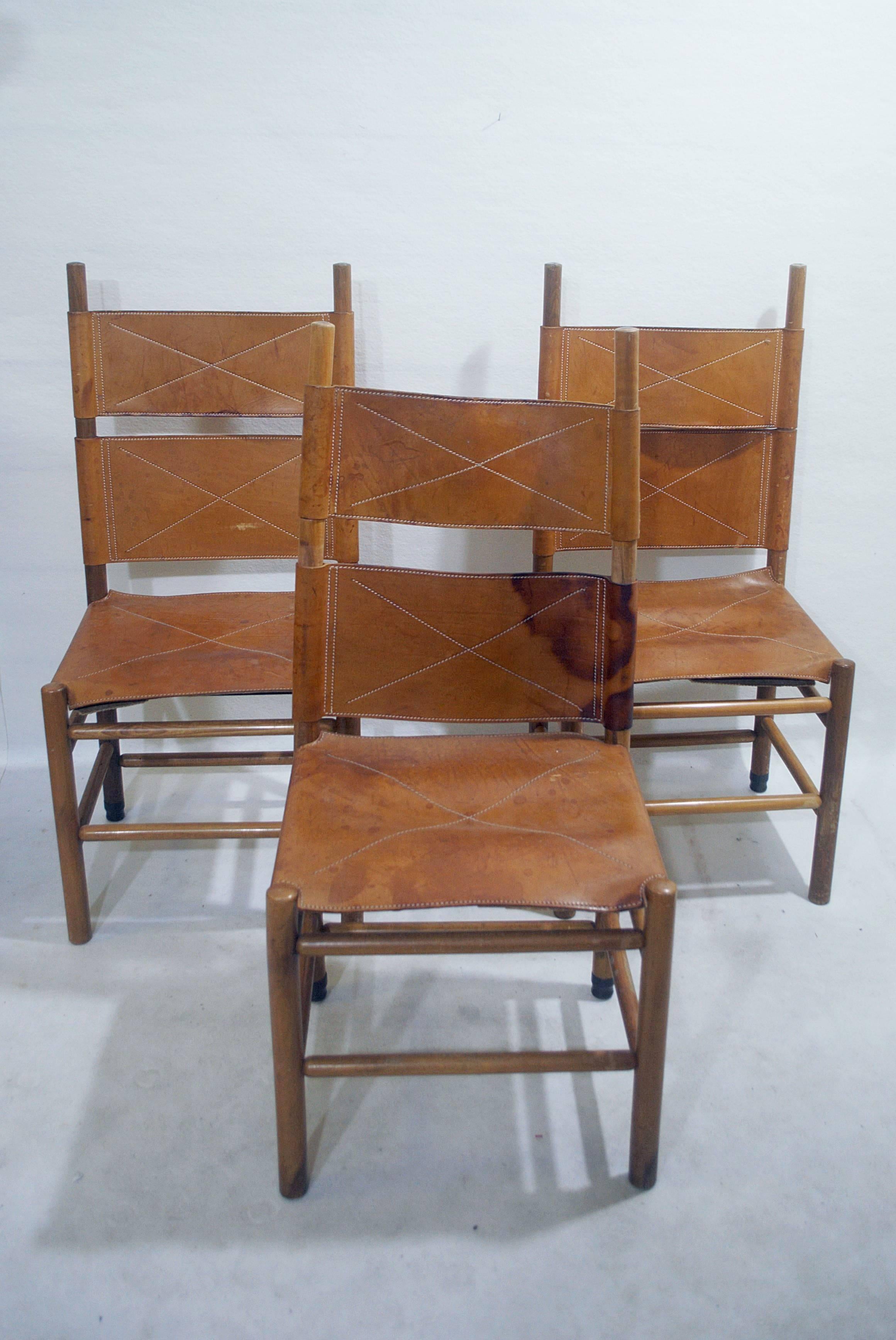 Set of six walnut and cognac leather chairs by Carlo Scarpa for Bernini, 1977.