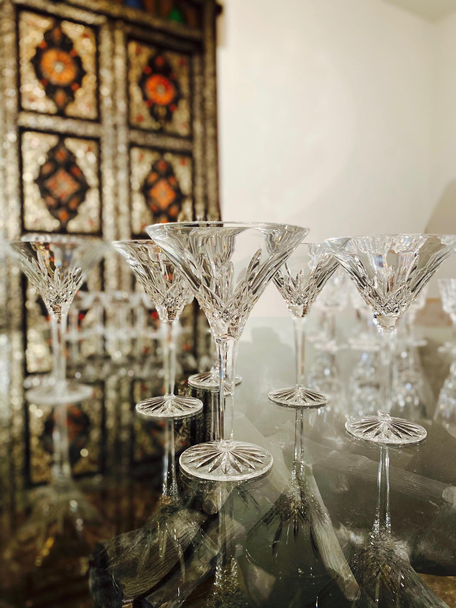 Set of six vintage luxury crystal tall martini glasses from Waterford Crystal. The Lismore Collection is perhaps Waterford's most distinguished design featuring hand blown crystal with the pattern's signature diamond and wedge cuts. First introduced