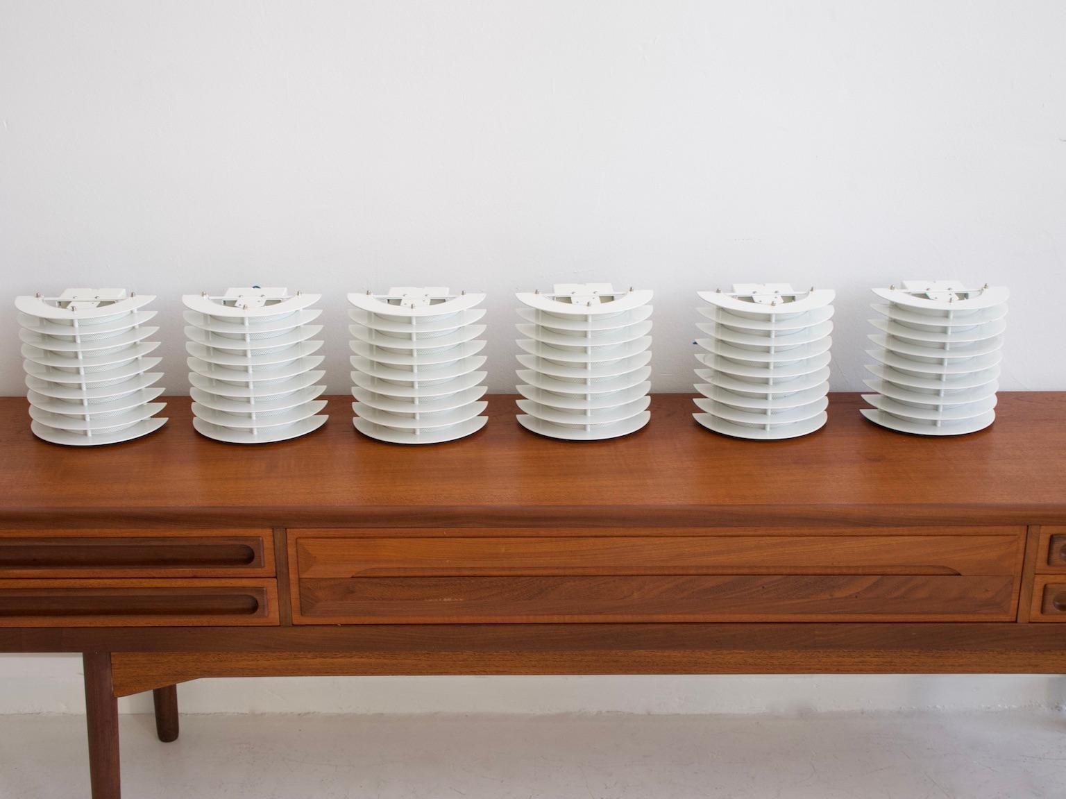 Set of six white lacquered metal wall lights by Boréns, Sweden. Labeled by maker and numbered 6434.