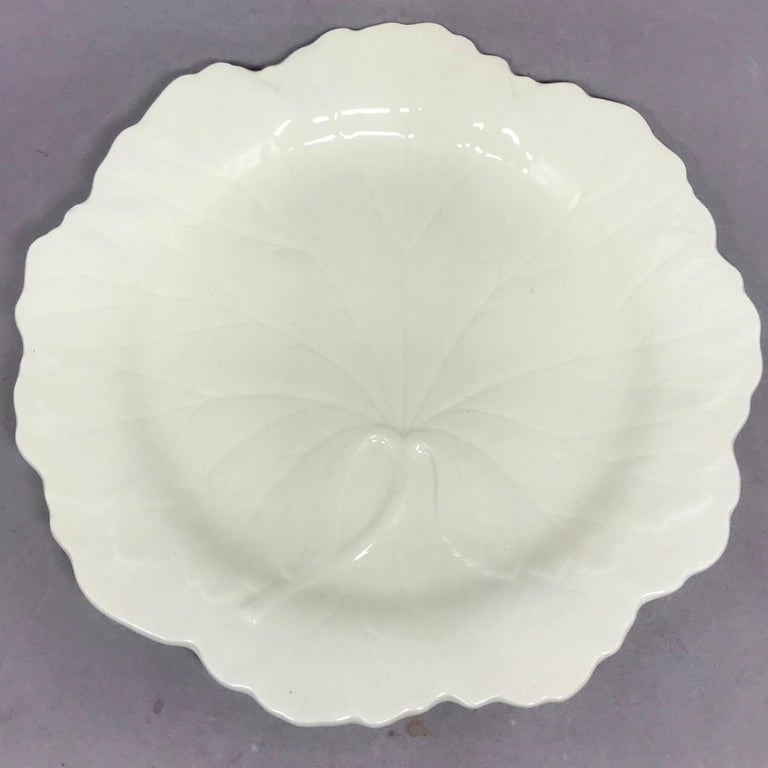 Set of six white Wedgwood grape leaf plates. Set of six vintage luncheon or dessert plates in a modern white grape leaf design; stamped Wedgwood. England 1953.
Dimensions: 8