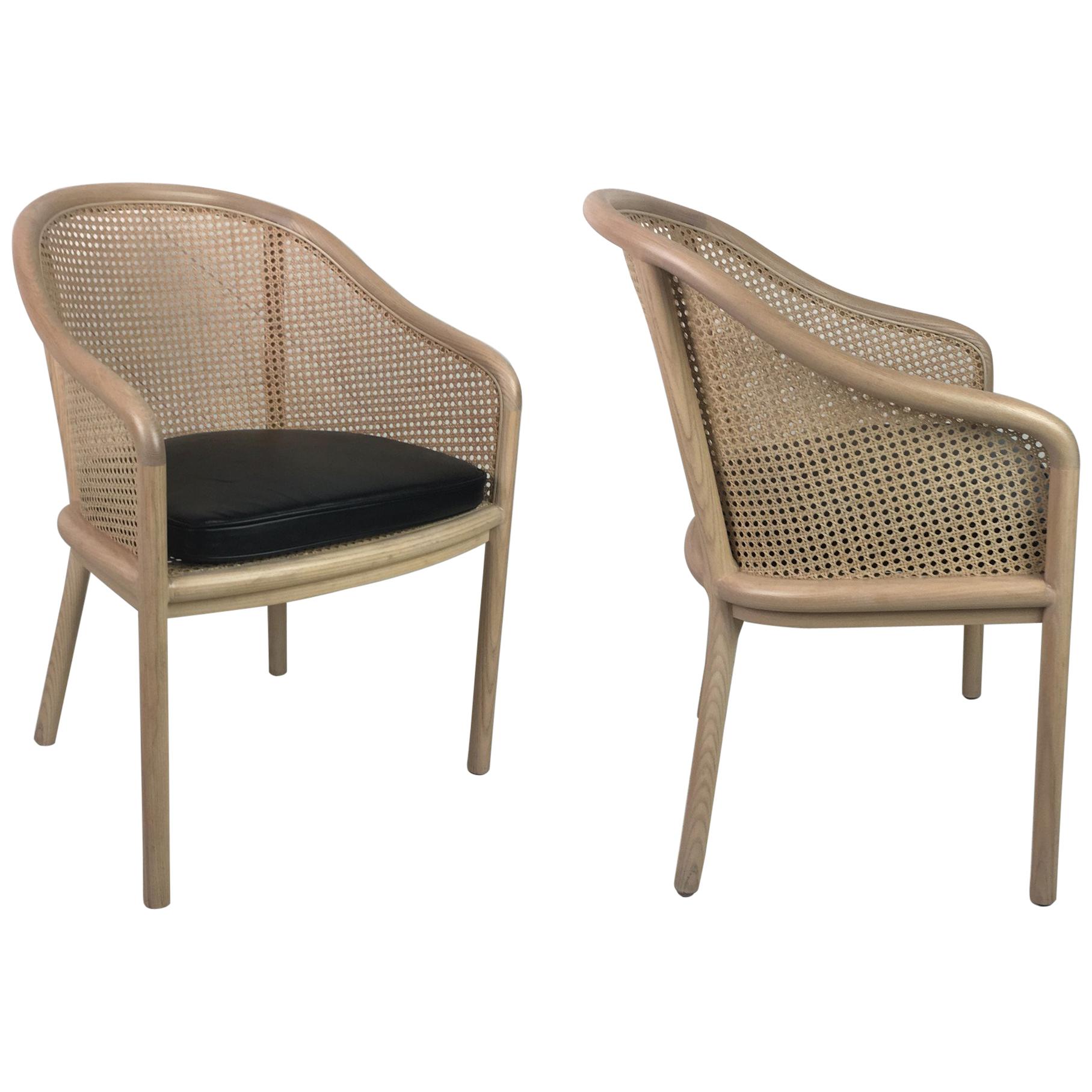 Beautifully restored set of six armchairs by Ward Bennett. The chairs have been given a Whitewashed stain and matte clear lacquer finish. The seat cushions have been freshly upholstered in fine Italian black leather.