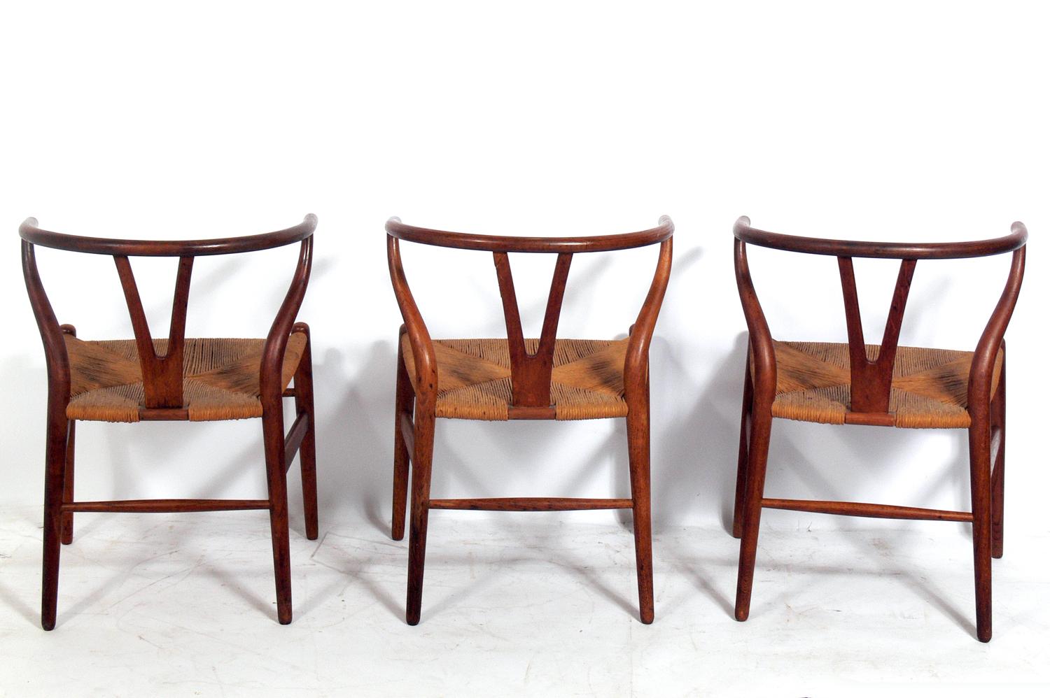 Set of six Danish modern oak wishbone dining chairs attributed to Hans Wegner, unsigned, Denmark, circa 1960s. They have been cleaned and Danish oiled.