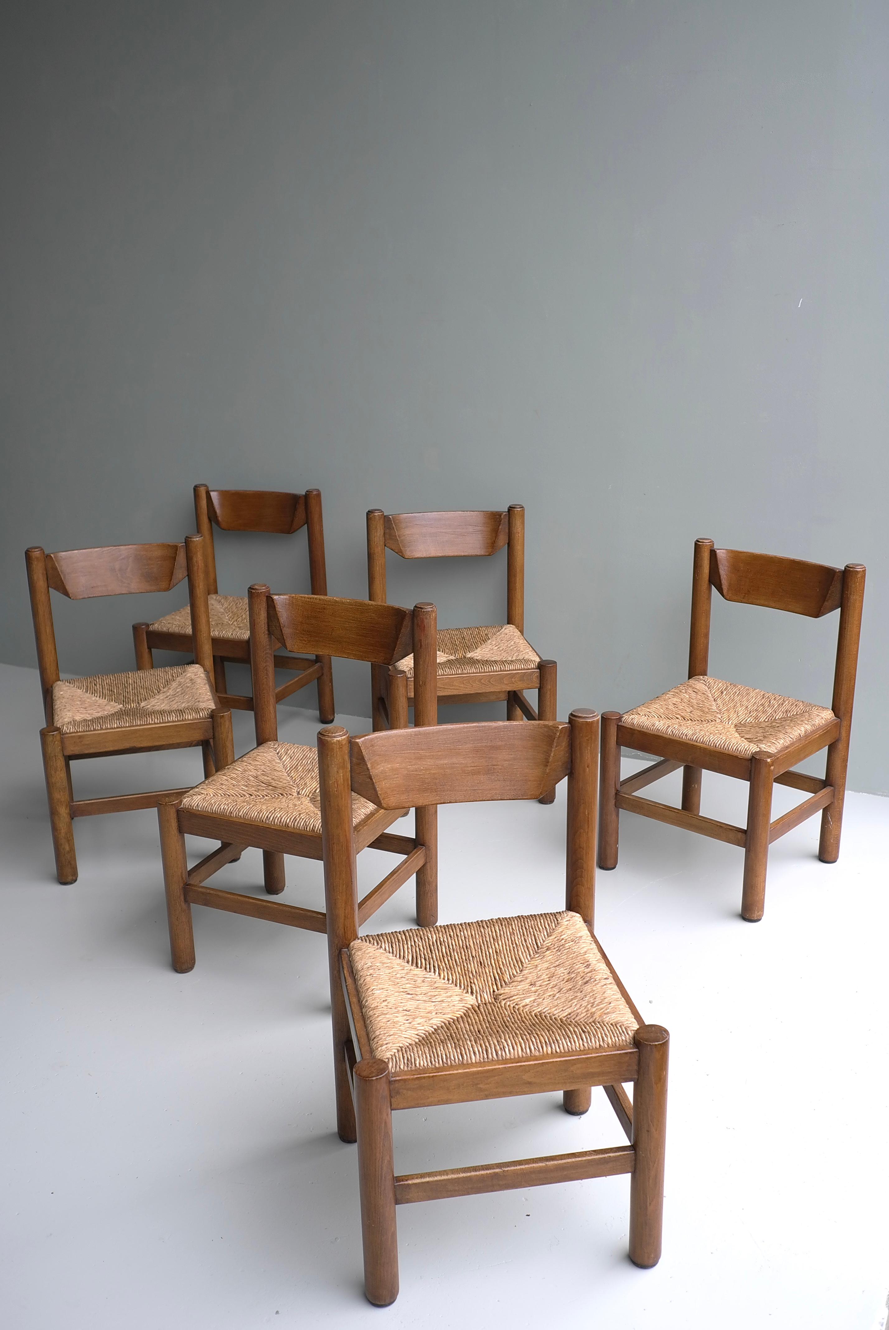 Set of six wooden dining chairs in style of Charlotte Perriand, France, 1960
Solid heavy wooden chairs with rush seats.