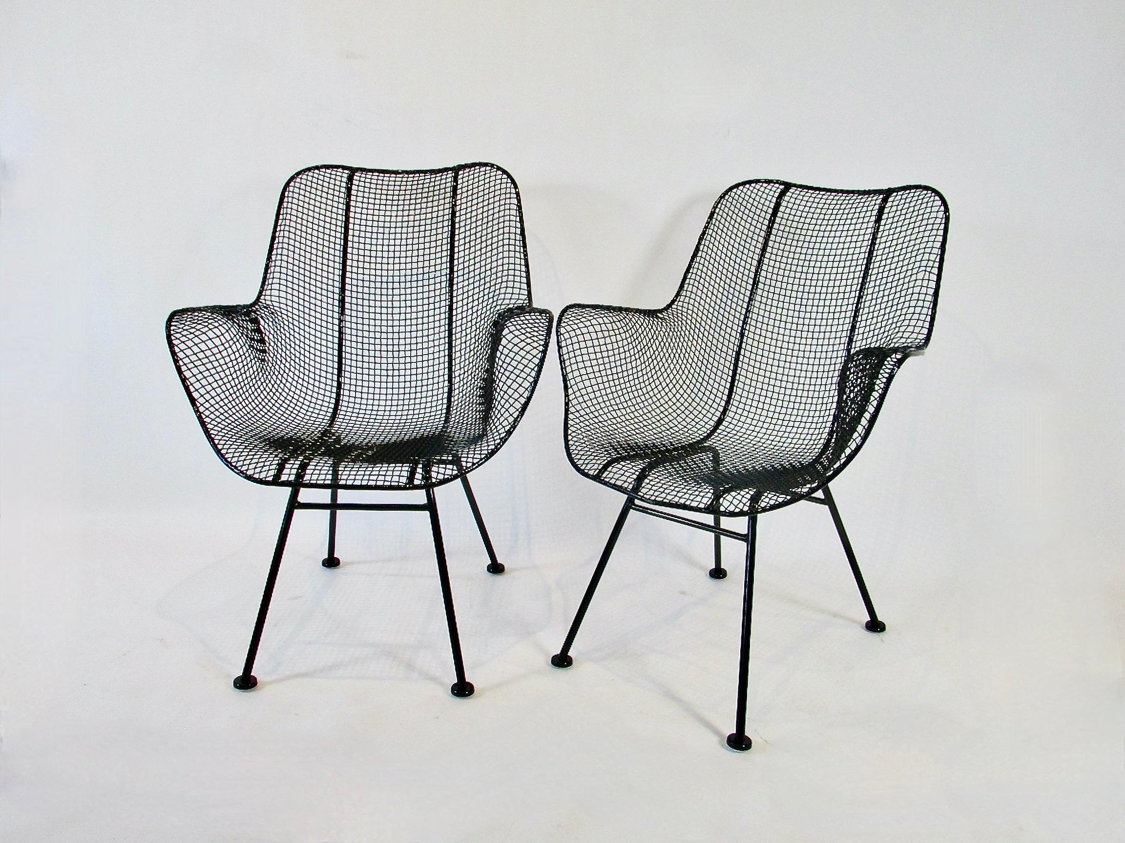 Somewhat rare set of six Woodard wrought iron with mesh seat high back dining chairs . Rare in that they are a set of six and truly dining height . So many Woodard chairs are game table height not full dining height . This set has been powder coated