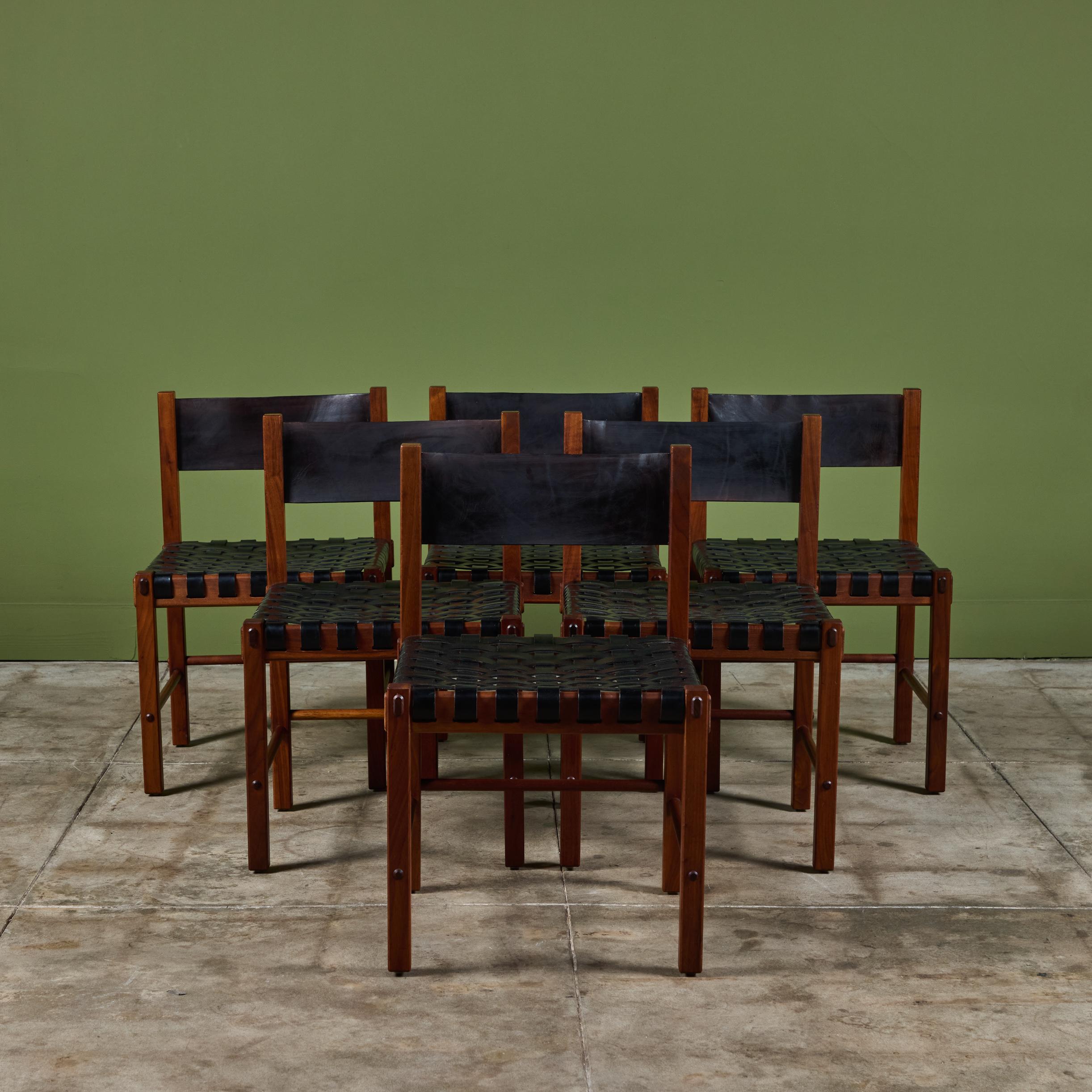 An eye catching set of chairs designed by Robert Baron for Glenn of California, c.1960s. This rare set of chairs features a rich walnut frame with woven leather seat and black leather backrest.

Dimensions
19