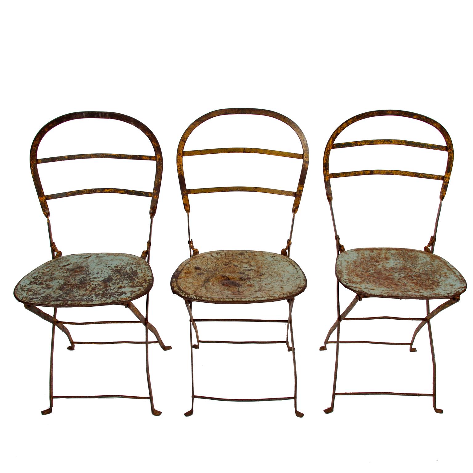 French, 19th century

A set of six, wrought iron and steel, folding chairs. Scraped back to the original paint. With great patina.