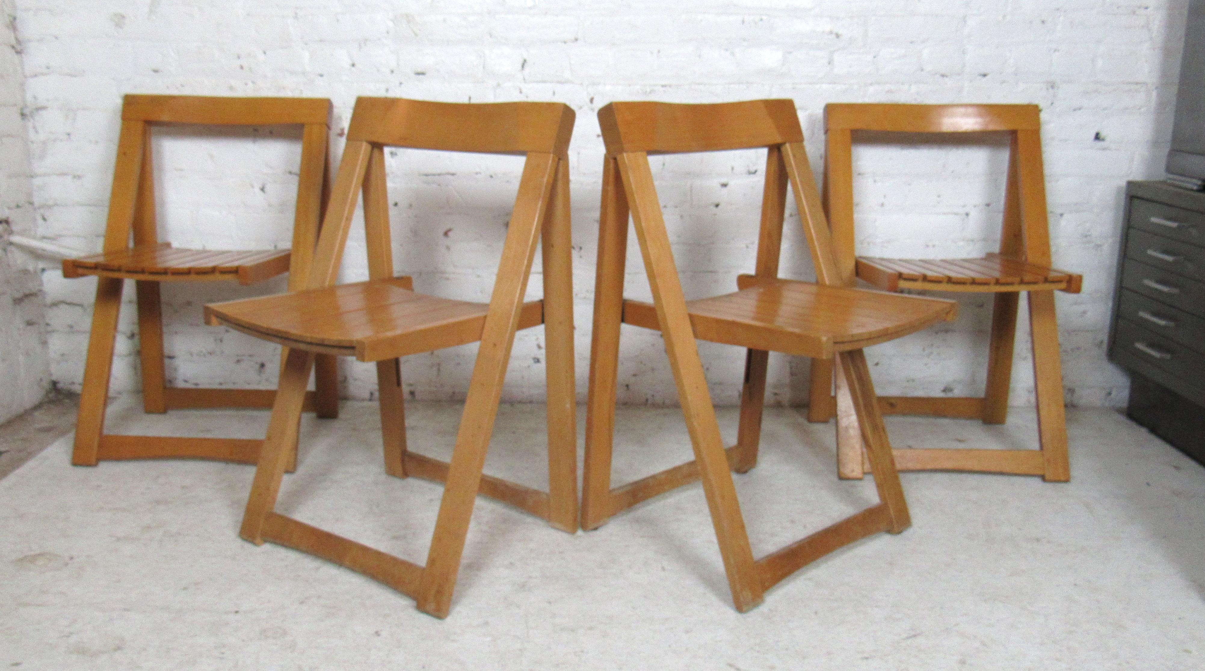 Mid-Century Modern wood folding chairs. Chairs fold for easy storage.
(Please confirm item location - NY or NJ - with dealer).
 