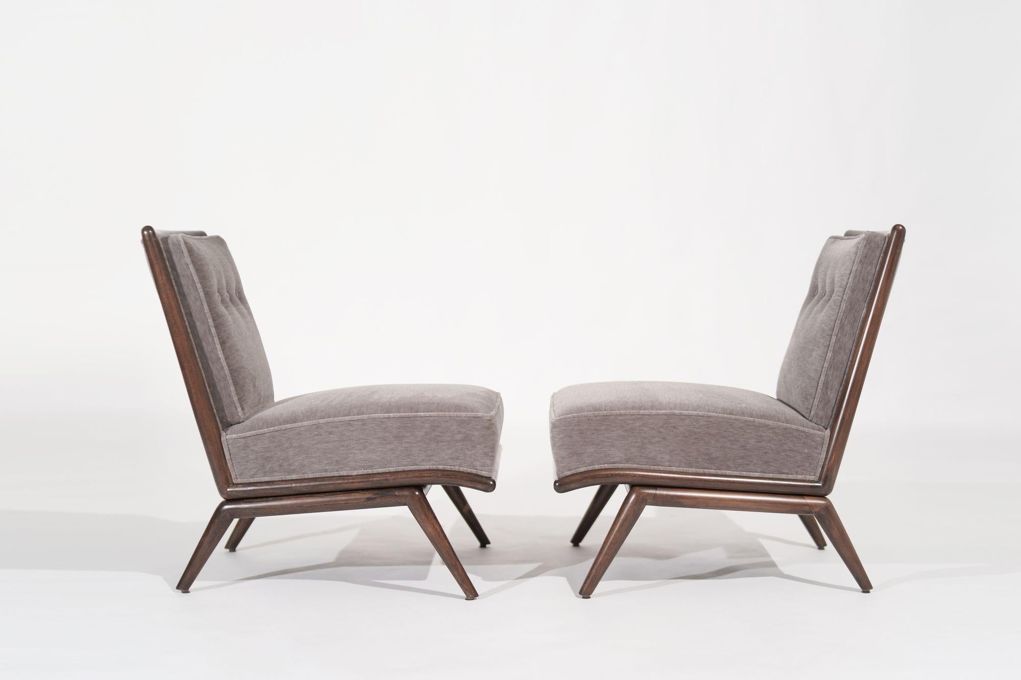 Indulge in the timeless allure of mid-century design with this pair of slipper chairs originally envisioned by the legendary T.H. Robsjohn-Gibbings in the 1950s, meticulously revived to their former glory by Stamford Modern. Adorned in opulent brown