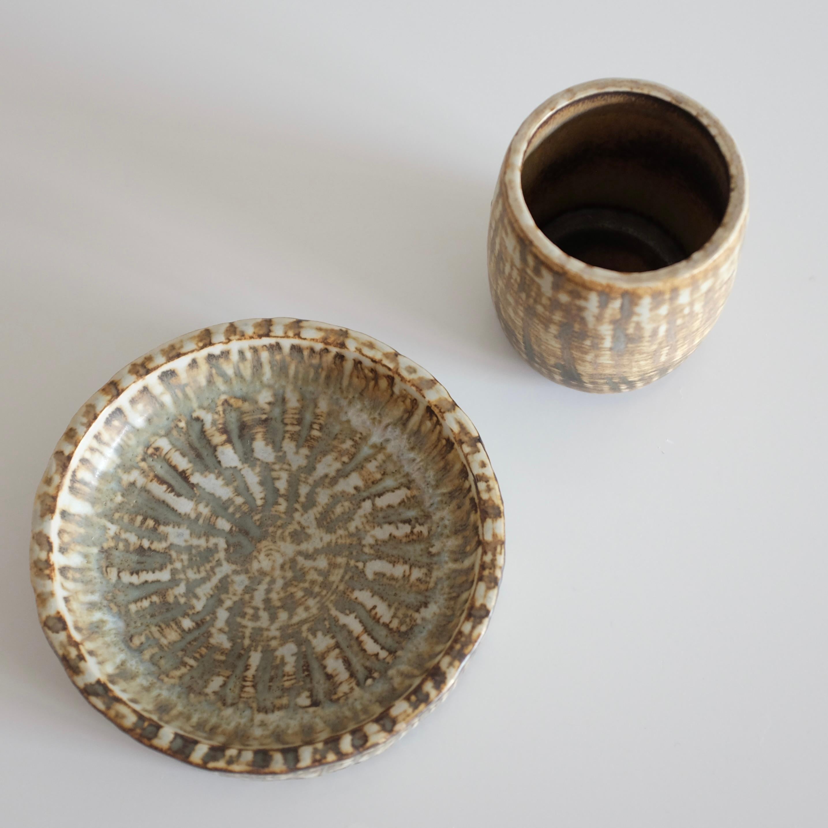 Set of Small Ceramic bowl and vase by Gunnar Nylund for Rörstrand, Sweden. Decorative flame like design in brown, black and beige colors with designers signature underneath and the different model numbers. In a very good vintage