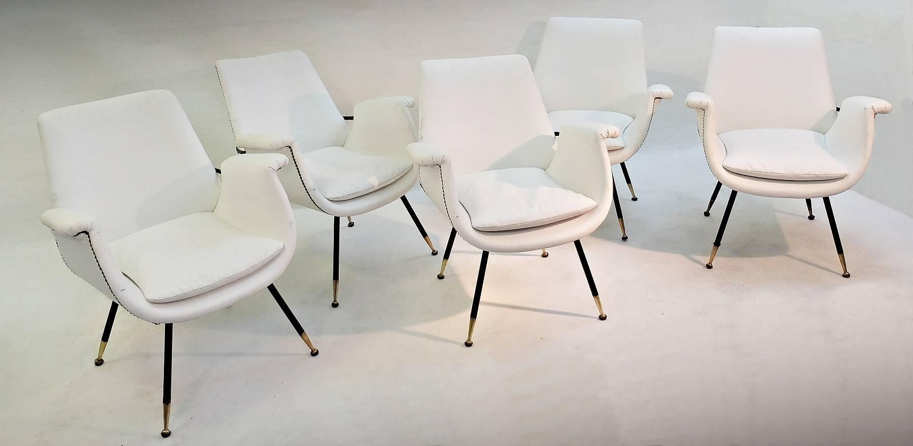 Set of small Italian armchairs in white faux leather, nine available.