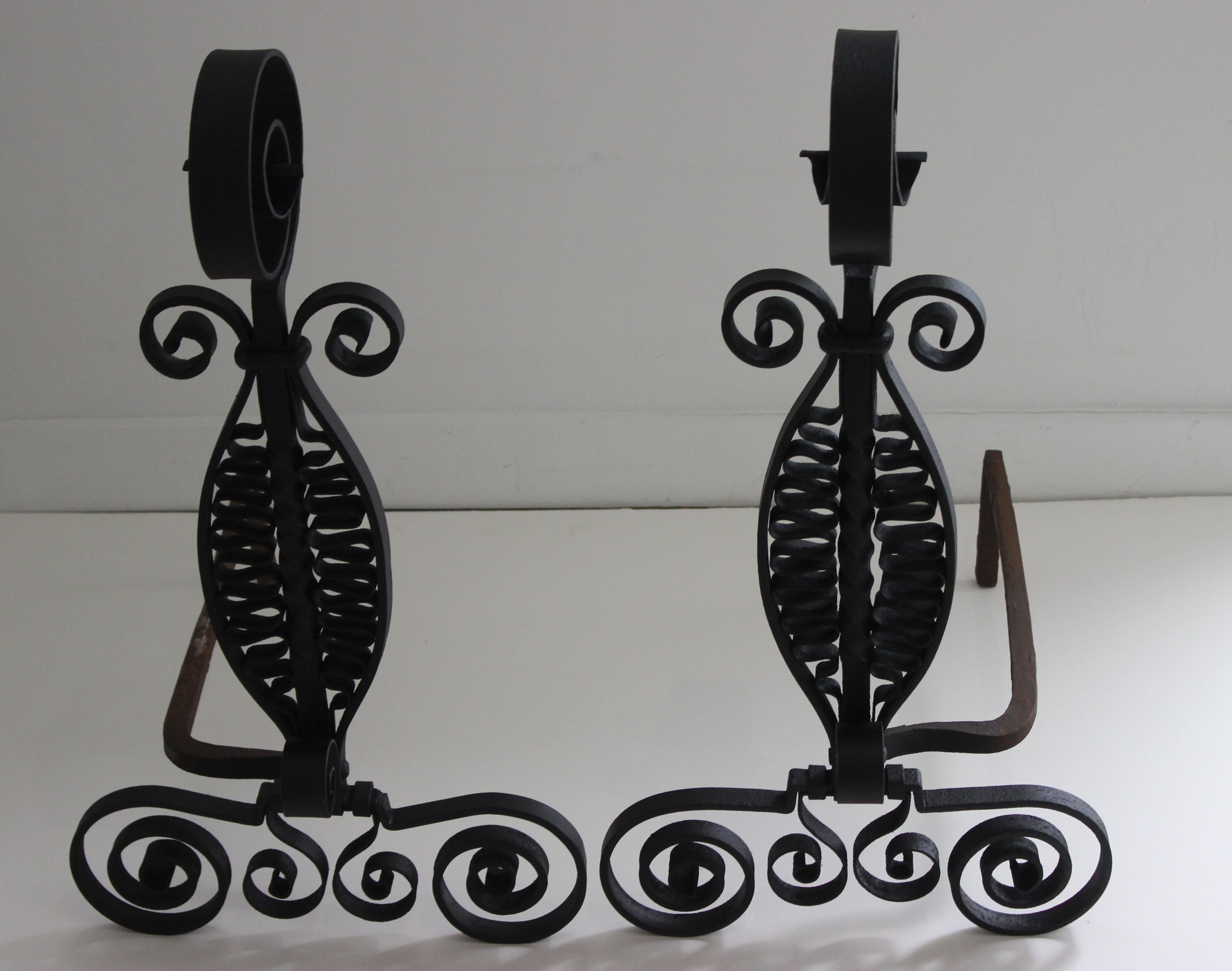 This stylish set of Spanish Colonial revival wrought iron andirons were acquired from an estate in Palm Beach and are attributed to Addison Mizner and they date to the early part of the 20th century.

  