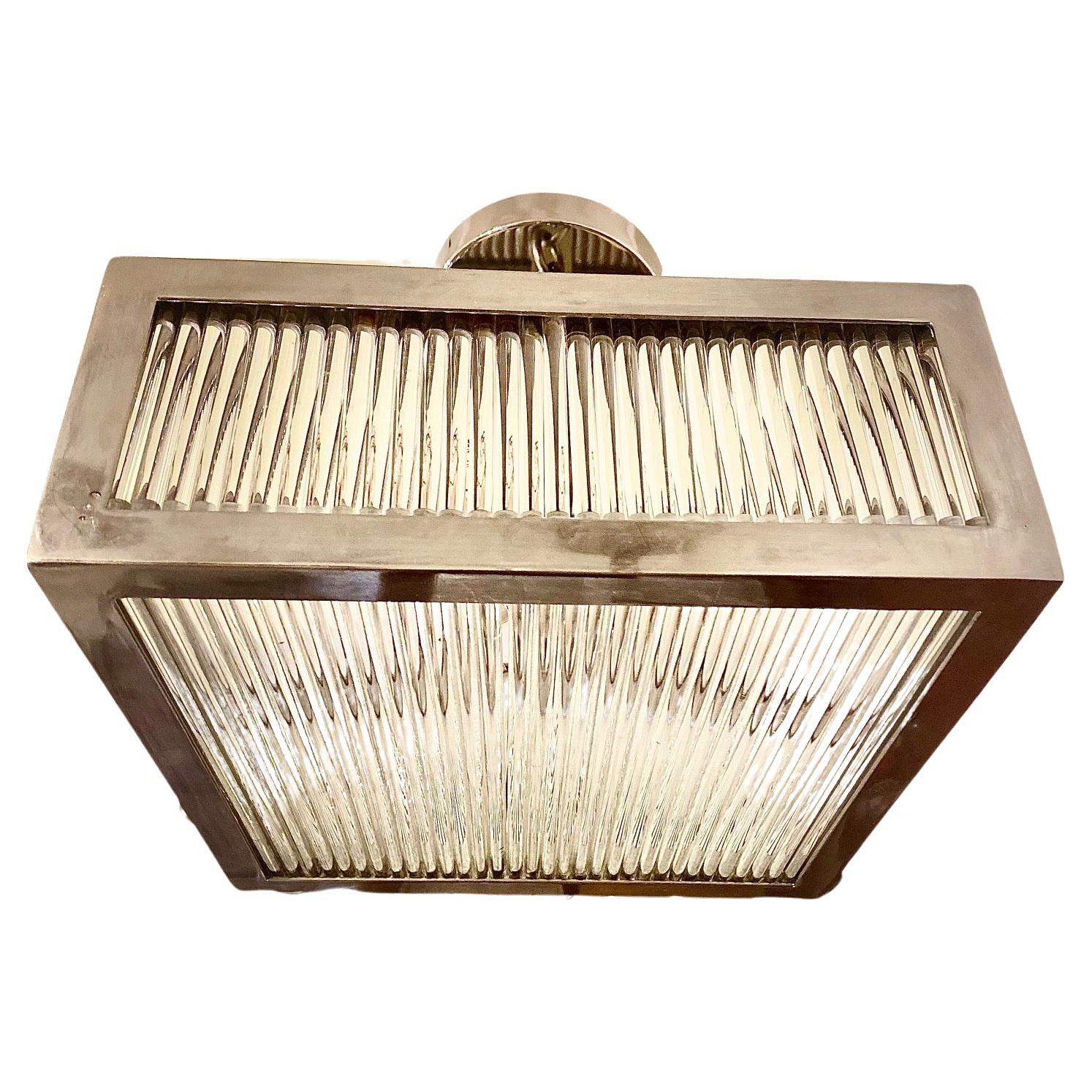 Set of circa 1960's French nickel-plated square glass-rod ceiling fixtures with 4 interior candelabra lights. Sold individually.

Measurements:
Length: 12