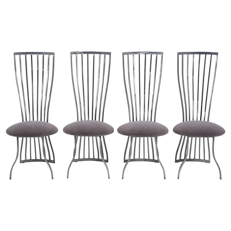 This set of four modern Italian dining chairs is made out of steel, is in great condition, and has been newly restored by our team of craftsmen. This eye-catching set of chairs feature sleek design frame, flat polish brushed finished, and seats