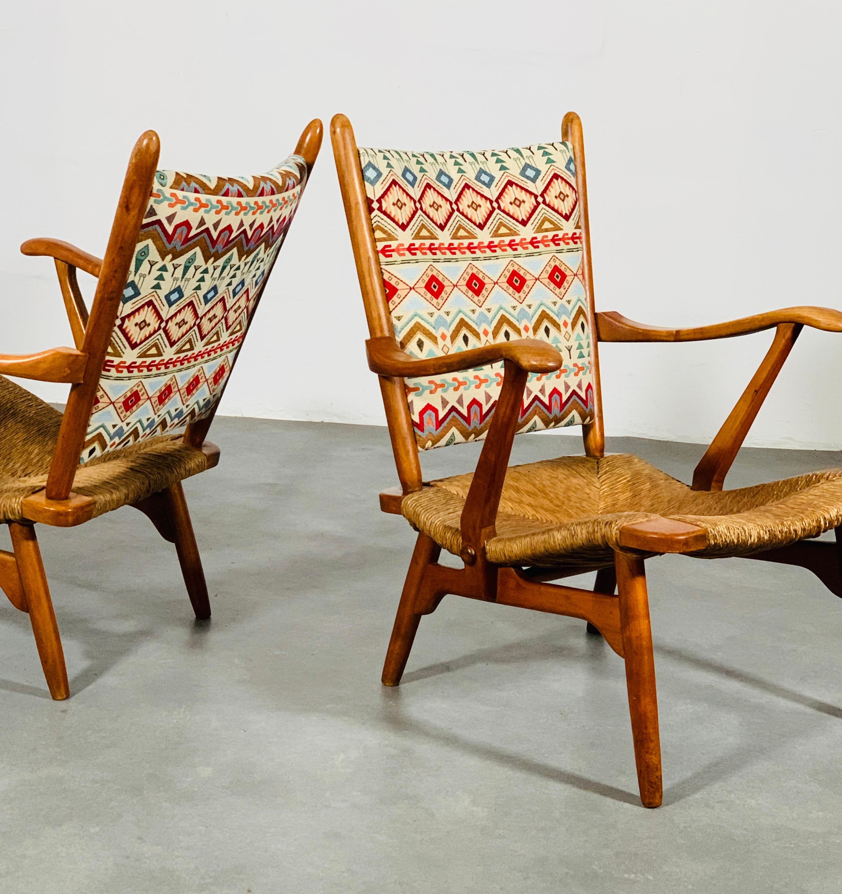 Set of ‘de Ster Gelderland ‘ rushed fruitwood armchairs, 1960’s. 
Very good condition. 
Recently reupholstered with American native fabric with typical Navajo patterns.

The arm chairs are in structural solid condition.

Rush seats in very good