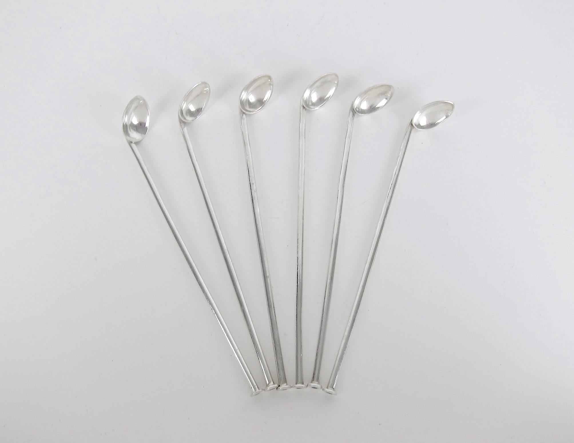 A vintage set of six iced tea or mint julep sipper spoons from the collection and estate of Peggy and David Rockefeller. The sterling silver spoons have long, hollow handles creating drinking straws for any cold beverage or cocktail served in a
