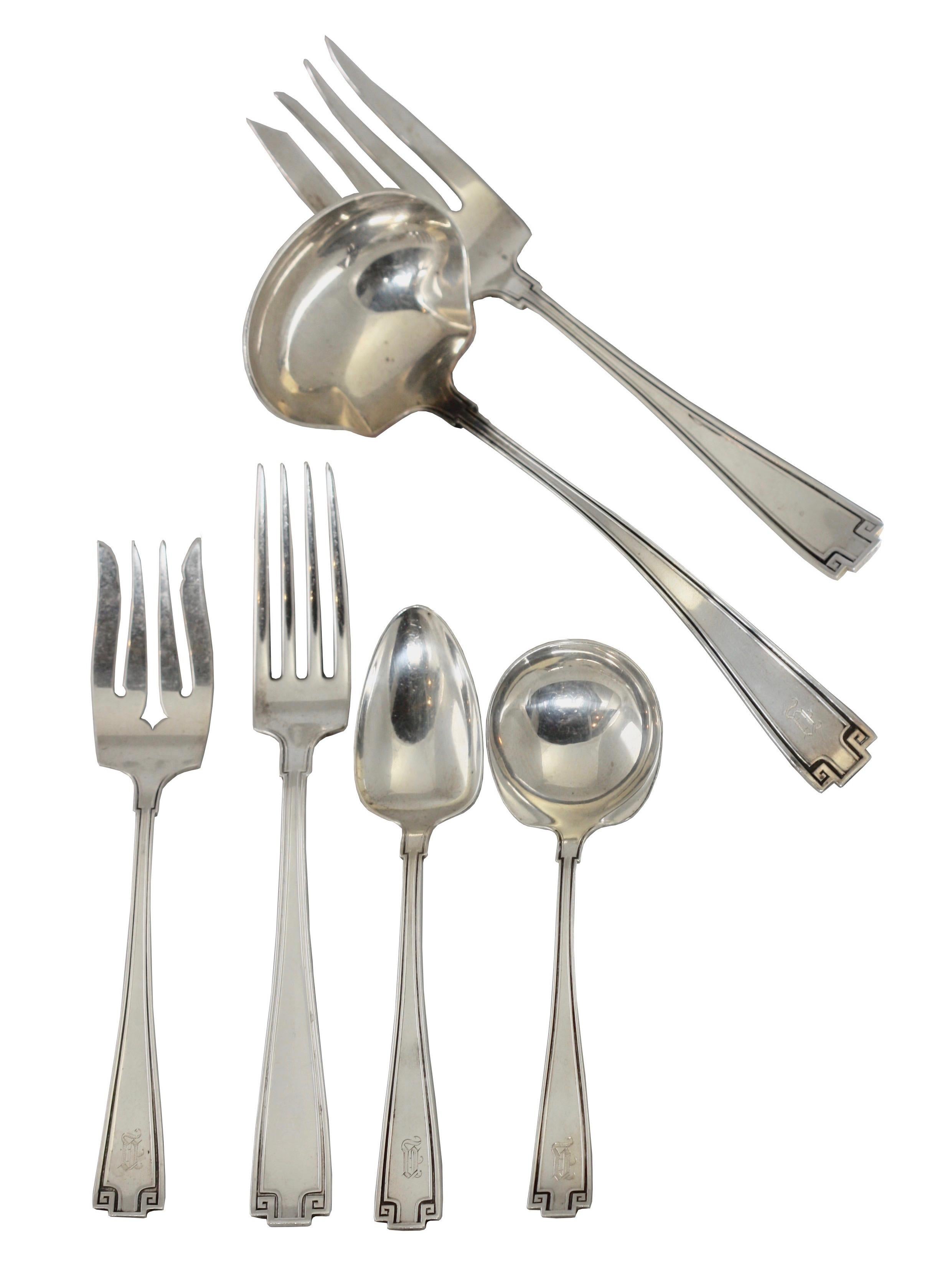 Set of sterling silverware by Gorham, Etruscan style, 1913.
Consisting of:
6 dinner forks (7 in.)
7 teaspoons (5 5/8 in.)
8 pie forks (6 1/4 in.)
12 round soup spoons (5 1/4 in.)
1 meat fork (7 in.)
1 gravy ladle (7 1/8 in.)
Total weight