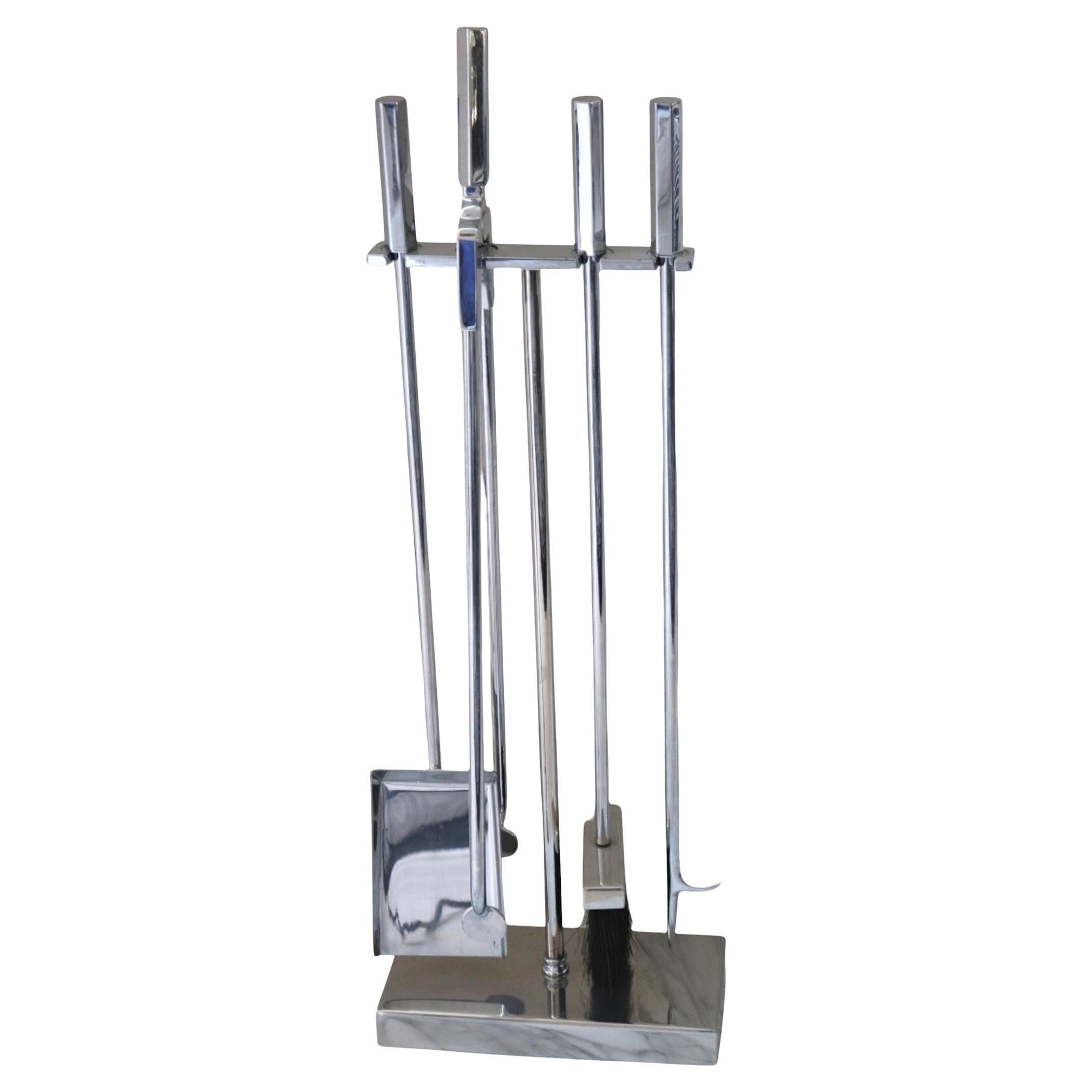 A set of stylish Modernist Polished nickel  Fire tools with a heavy solid base stand and 'T[' rod ,  including a poker, broom,  shovel and tongs.

Superb quality, great design , heavy and well-made.

dimensions :  approx. 11” W  x 5” D  x 31 ”