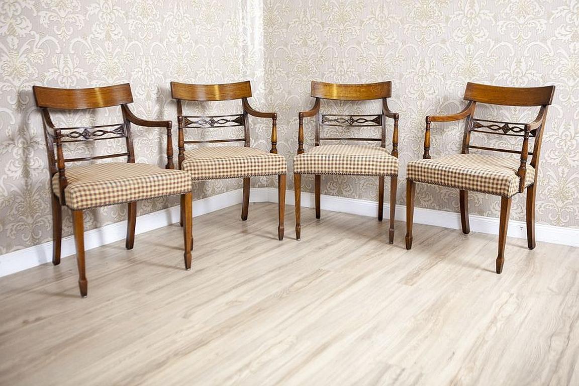 Set of Stylized Oak Armchairs From the Mid. 20th Century in Light Colors

We present you four lightweight armchairs with softly upholstered seats.
The armrests turn into the rails, which are the extension of the front legs.
The backrests are