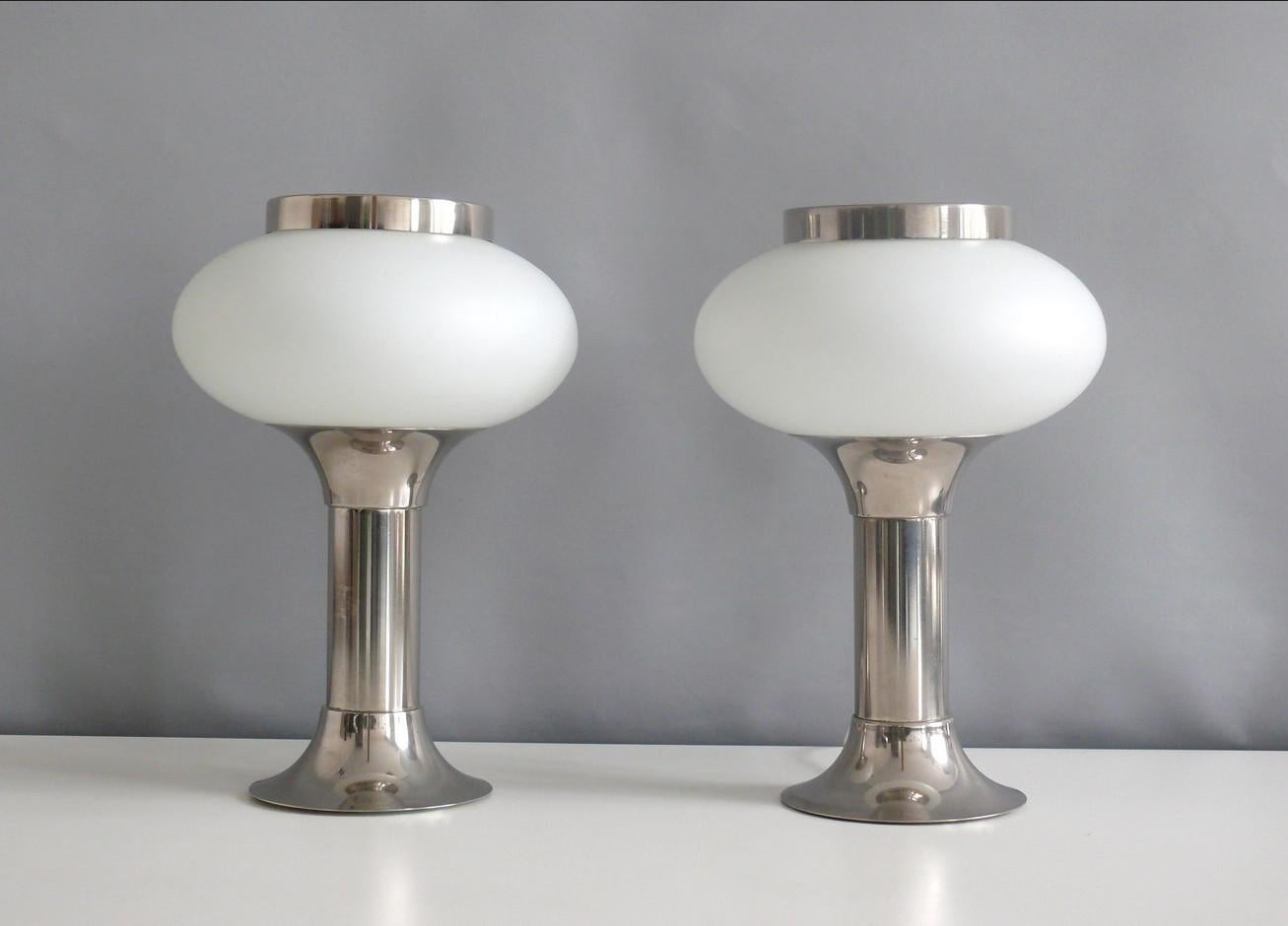 Two rare and elegant table lamps made of opal glass with a chrome-plated metal base by VEB Narva Leuchtenbau Lengenfeld, GDR - design Classic of the Space Age era, 1970s. A special feature of this lamp is the metal ring loosely placed on top of the