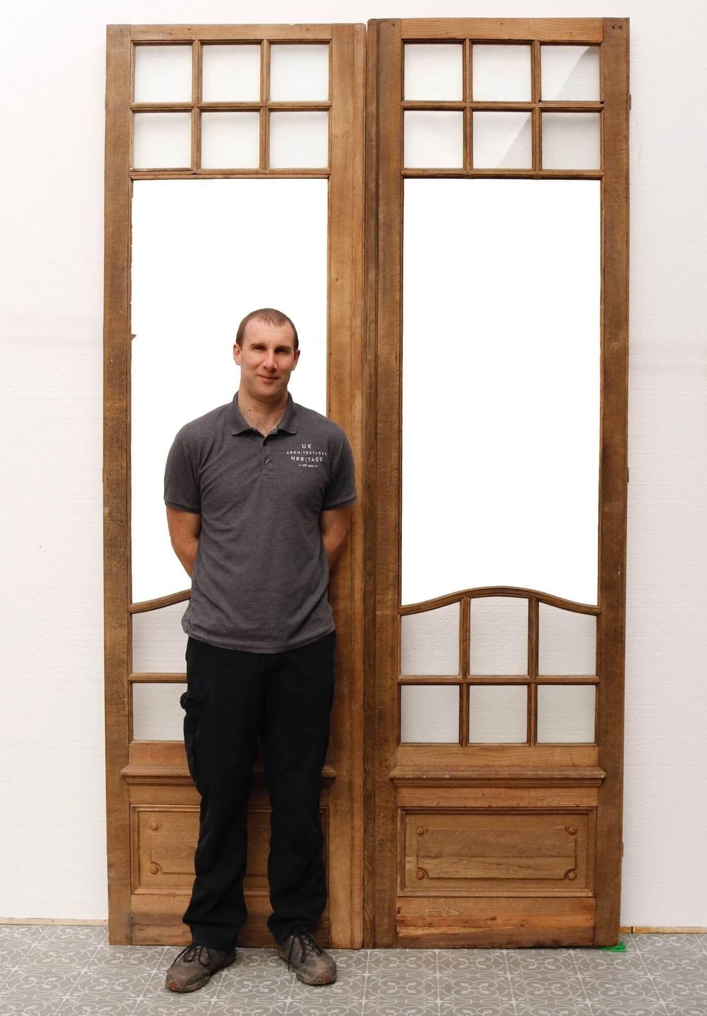 This elegant set of tall reclaimed oak double doors will make a beautiful feature of a historic period property or contemporary home alike. Suitable for internal use, these antique doors are partially glazed, with good quality clear glass to the top