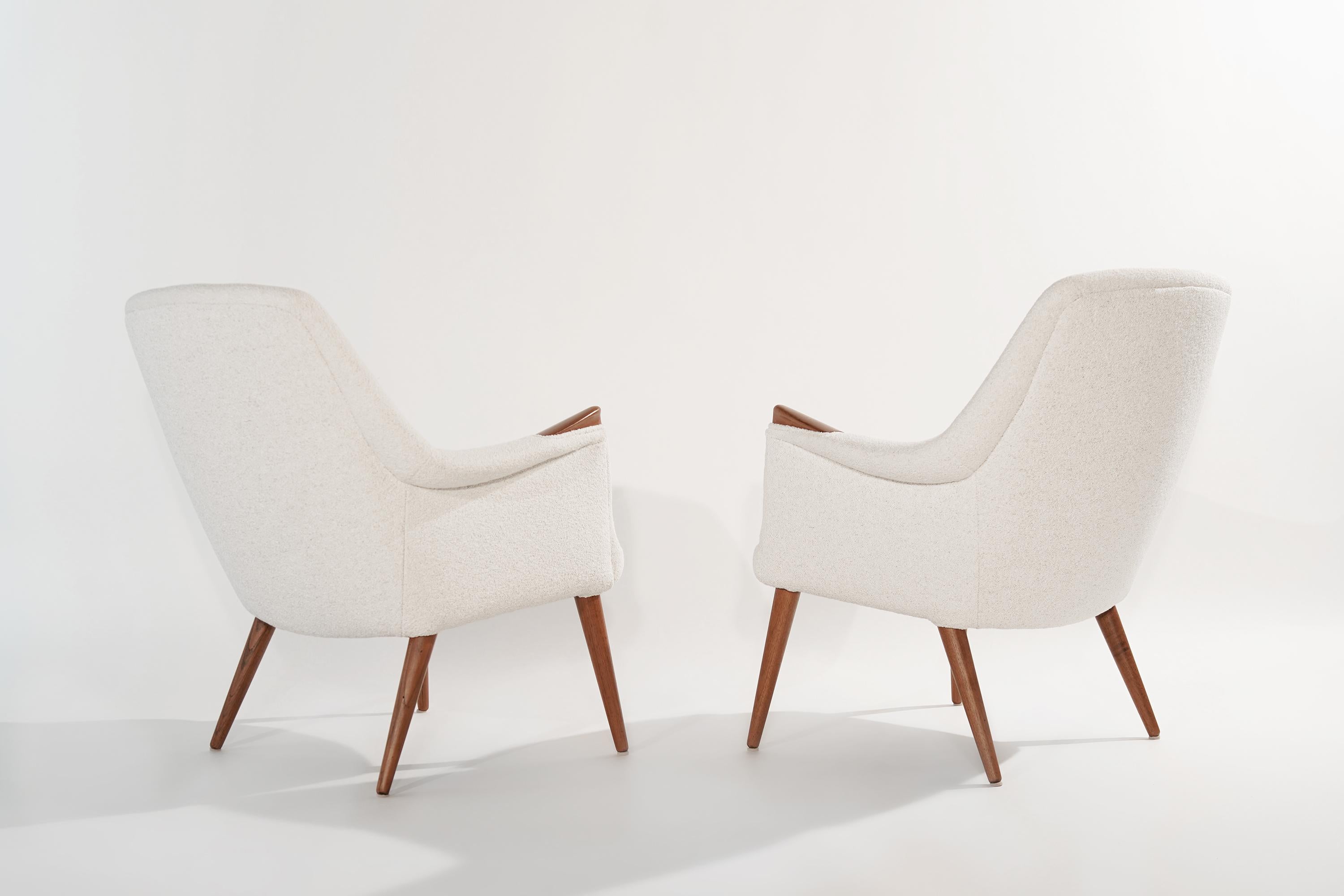 A rare set of Scandinavian-Modern lounge chairs designed by Gerhard Berg, Norway, circa 1950s. Newly upholstered in Italian boucle, teak legs and arm accents fully restored.

Other designers of the period include, Finn Juhl, Kaare Klint, Hans