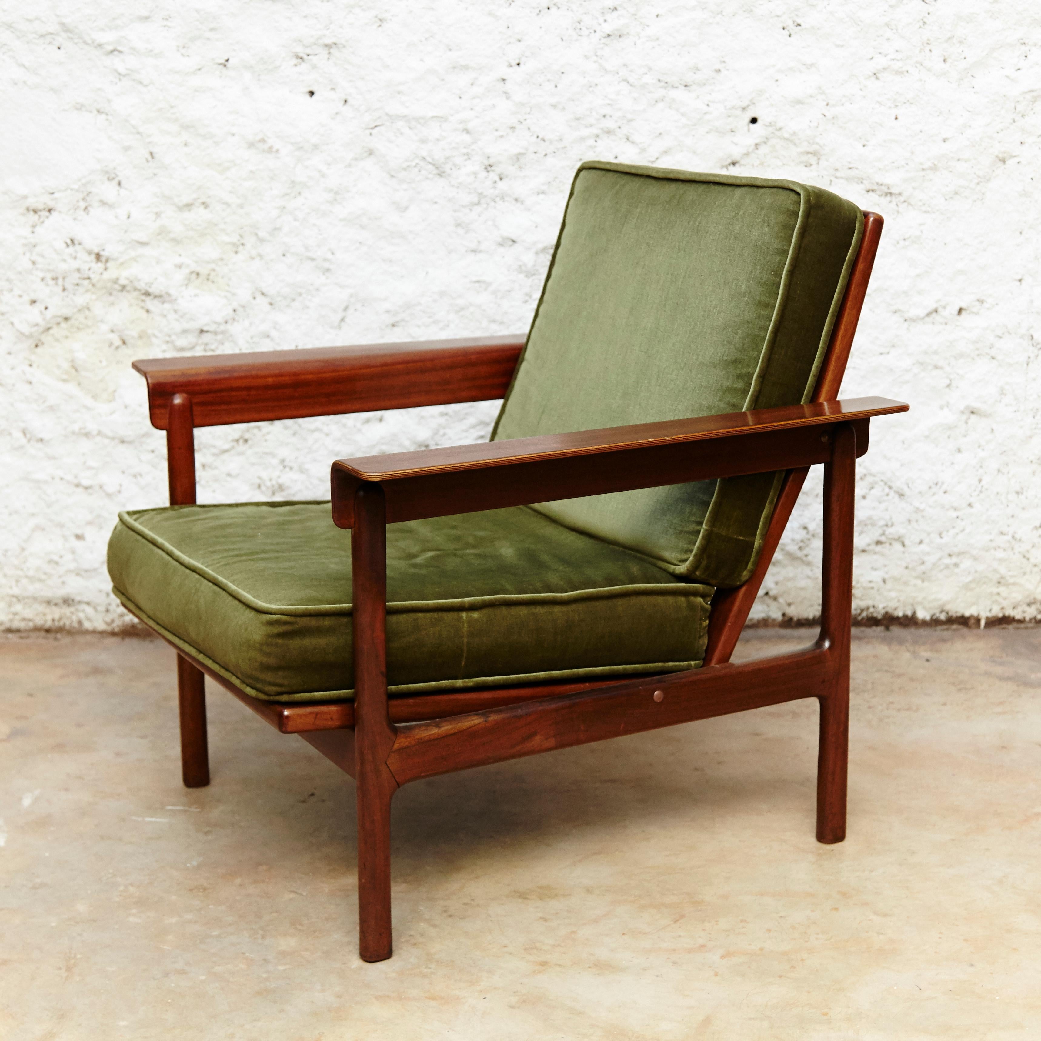 Set of two easy chairs.
Manufactured by AG Barcelona, circa 1960.
Made in teak wood with original green upholstery.
Scandinavian style.
Stamped by manufacturers label.

In original condition with minor wear consistent of age and use,