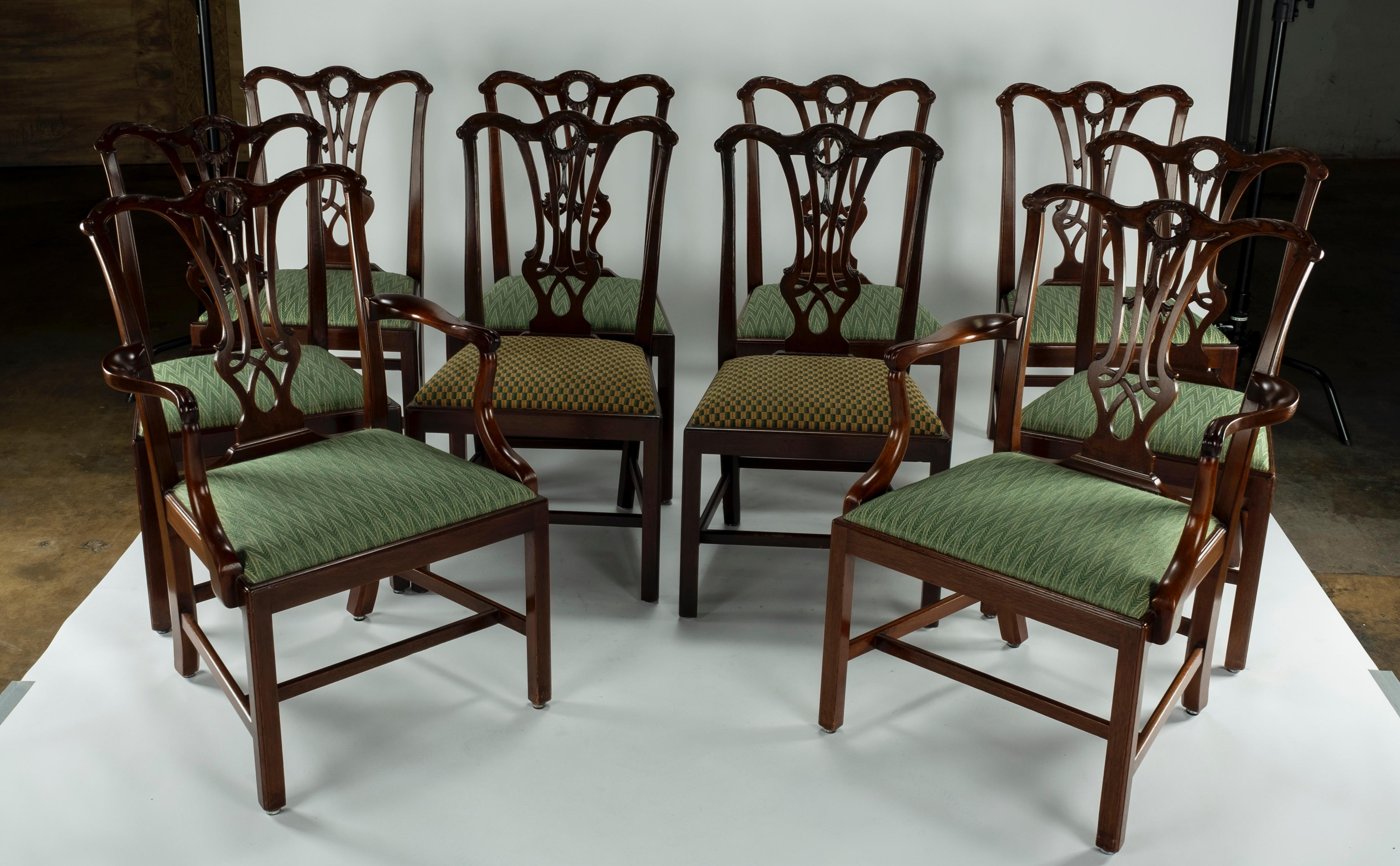 Set of ten mahogany dining chairs including two carvers and 8 side chairs. Serpentine crest rail has a pierced splat above a slip seat, straight square legs with molded corners joined by stretchers. Two of the side chairs were copied in the 1980s to