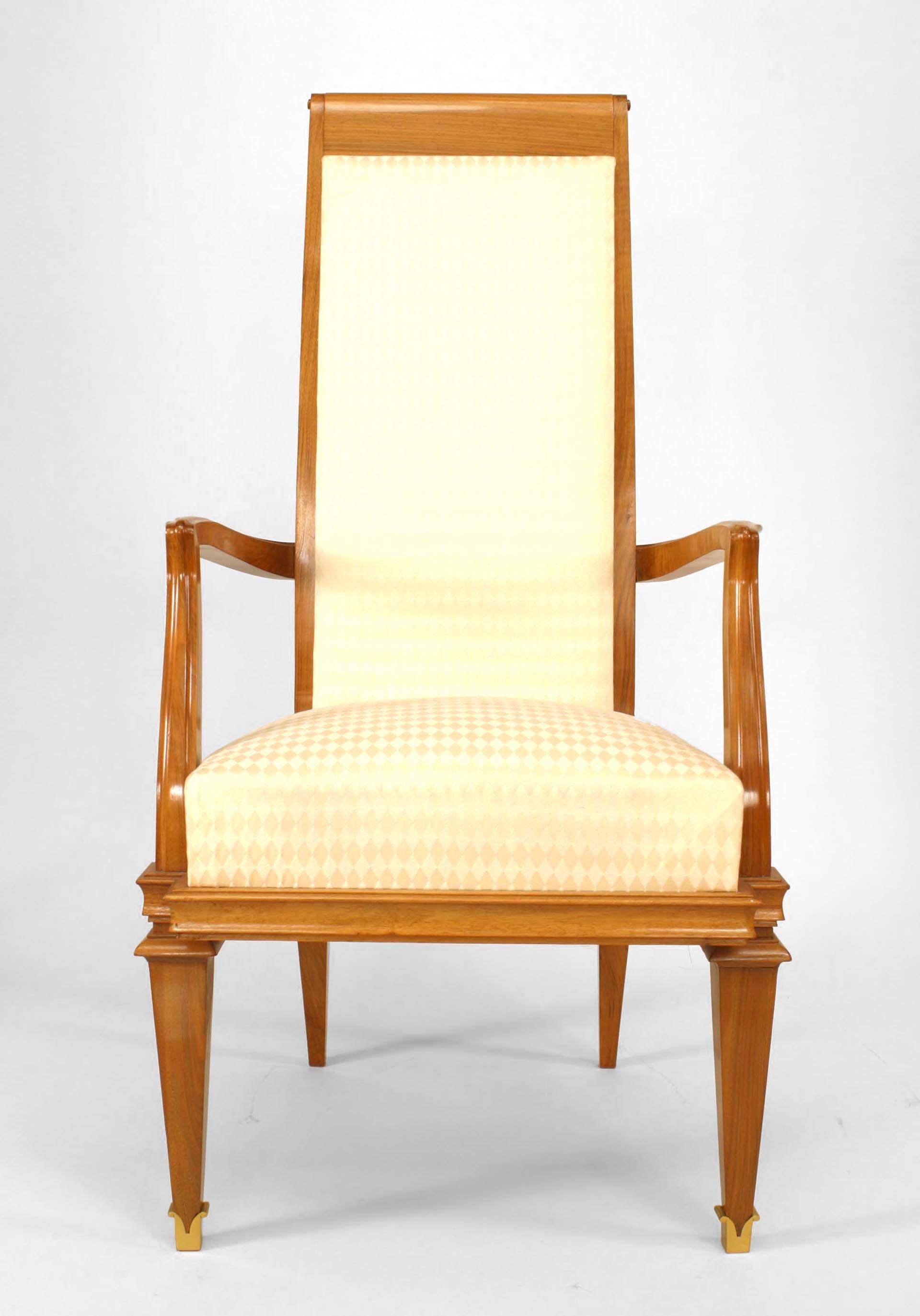 Set of 10 French 1940s brass mounted walnut high backed open arm chairs upholstered in white muslin (att: ROGER Le MANACH)
