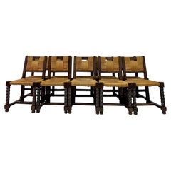 Ensemble de dix chaises de salle à manger en chêne français et jonc des années 1940