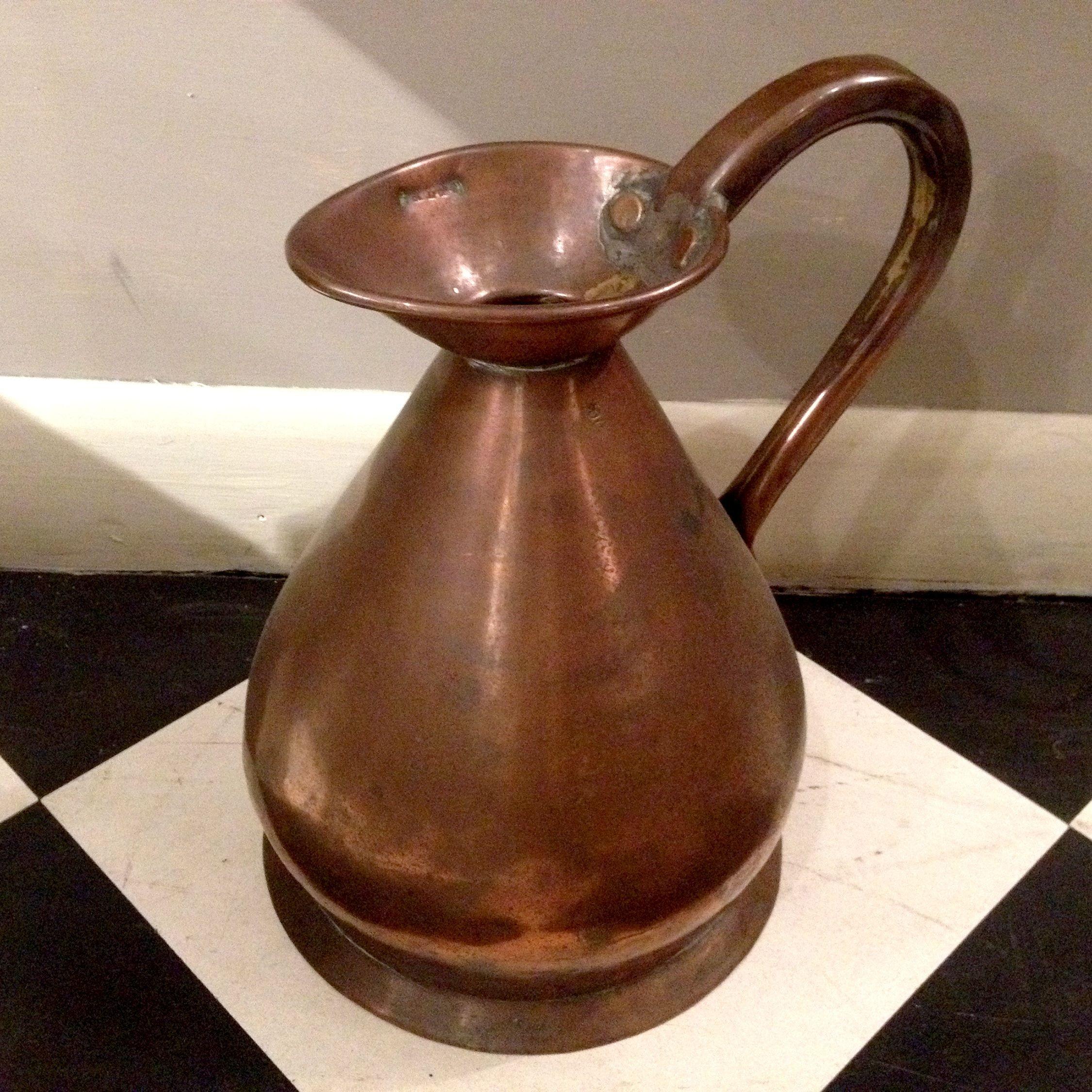 Set of ten copper jugs of various sizes.

Largest is 14 ½