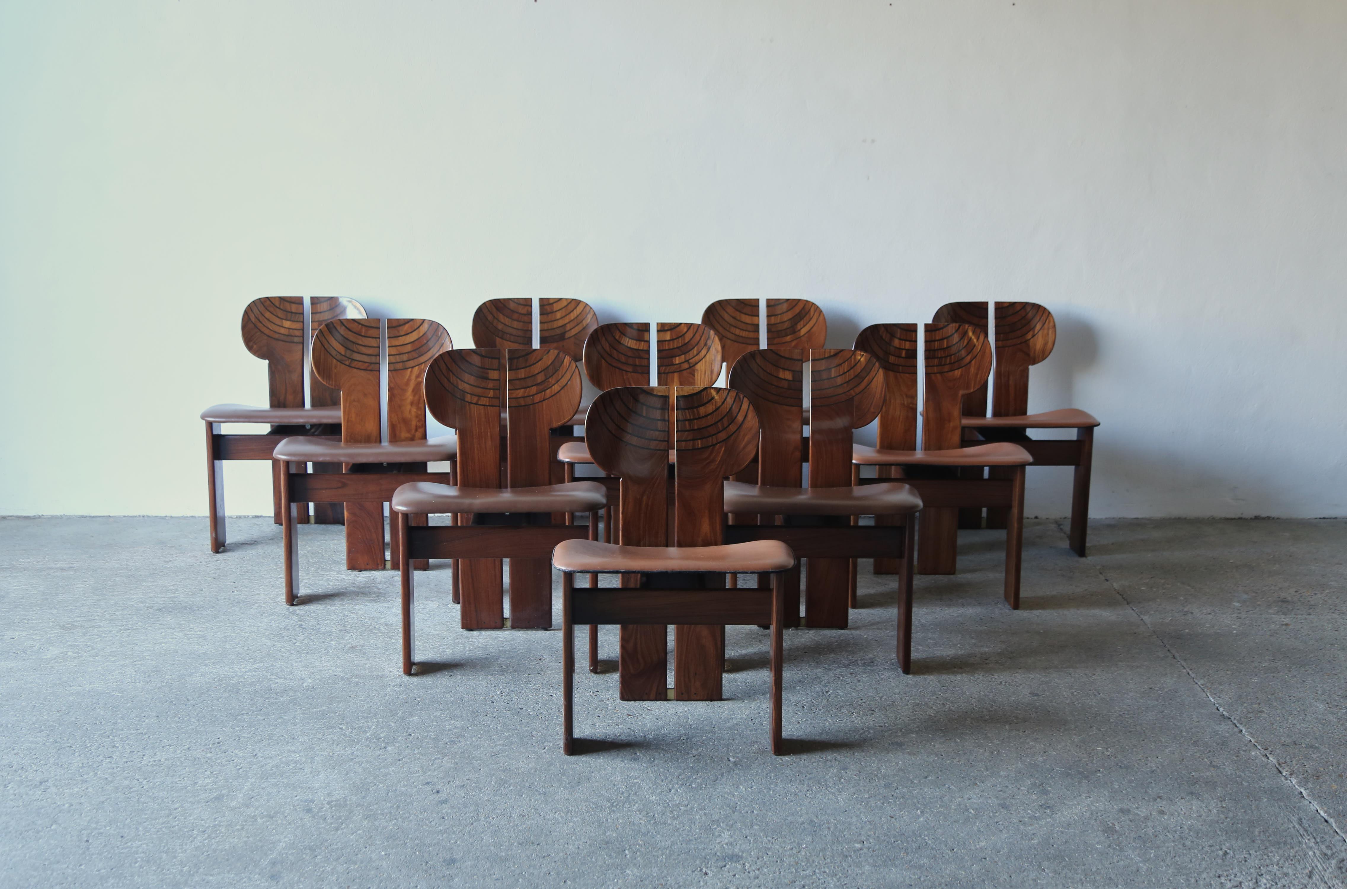 A rare set of ten stunning Africa chairs designed by Afra & Tobia Scarpa in the 1970s, and produced by Maxalto, Italy. These are great examples in rare exotic hardwood, burl, black leather and brass. Very good original condition with normal minor