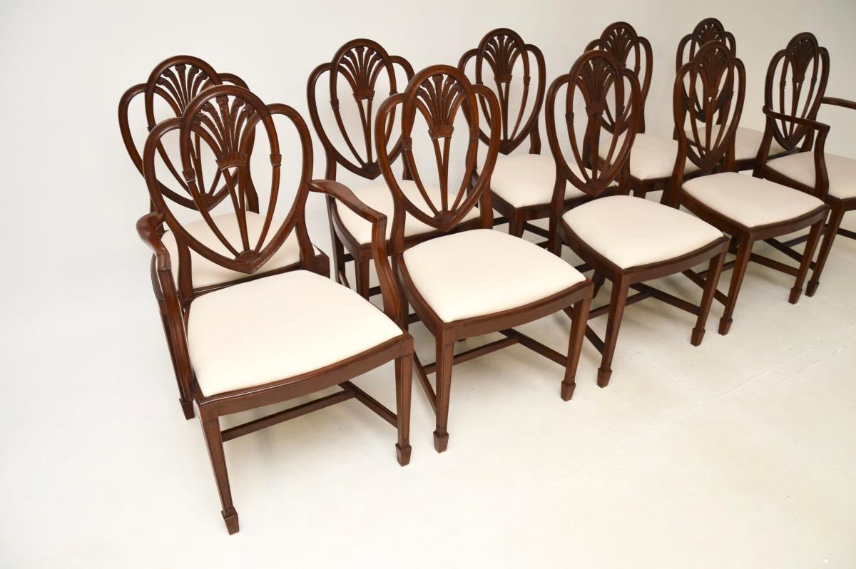 A superb set of ten antique shield back dining chairs, consisting of eight straight side chairs and two with arms. They were made in England, they date from around the 1920-30’s period.

The quality is outstanding, the tops of the backs have triple